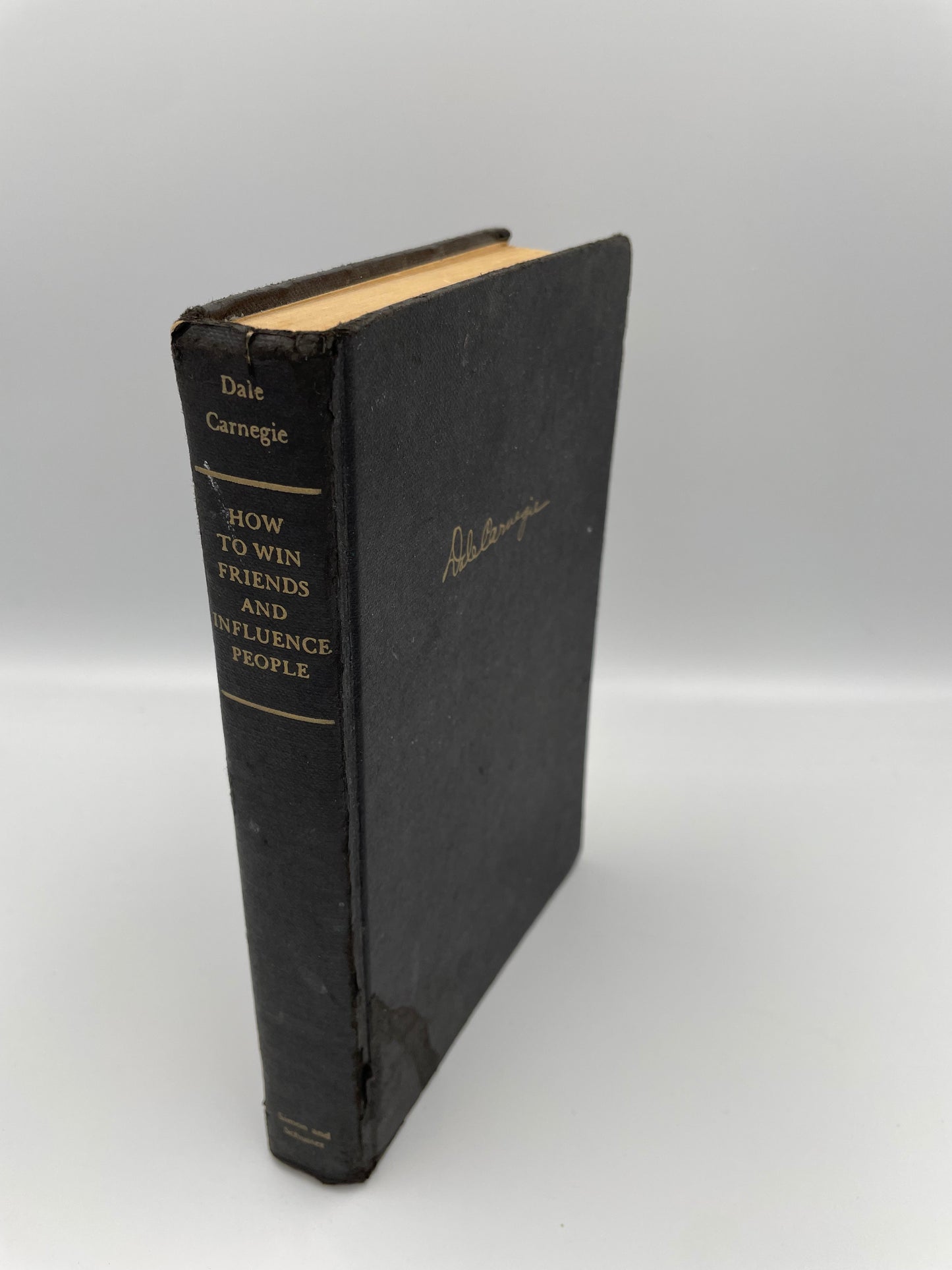 Book cover and spine of 'How to Win Friends and Influence People' by Dale Carnegie, 1st Edition