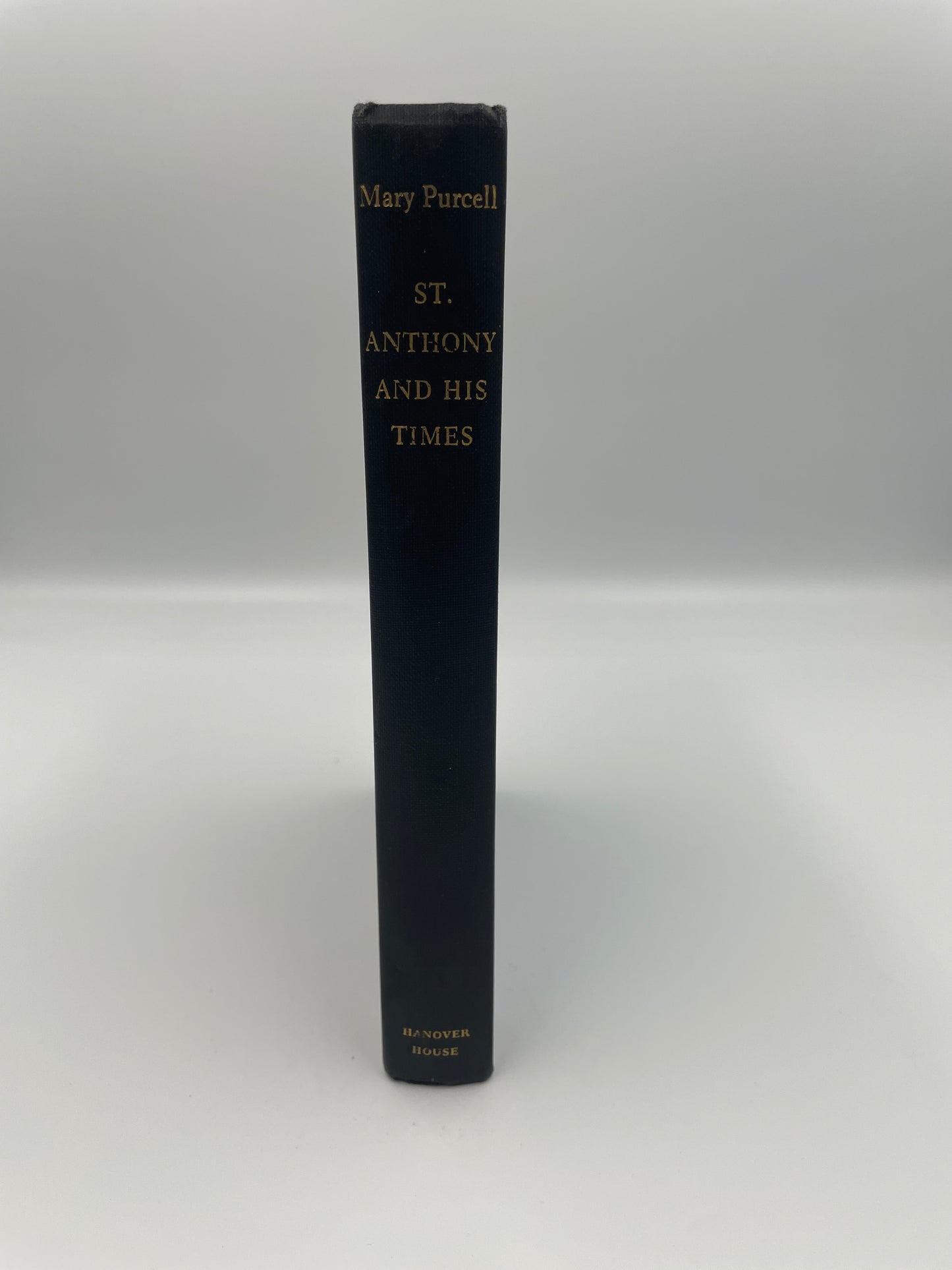 Black book titled 'St. Anthony and His Times' on a white background