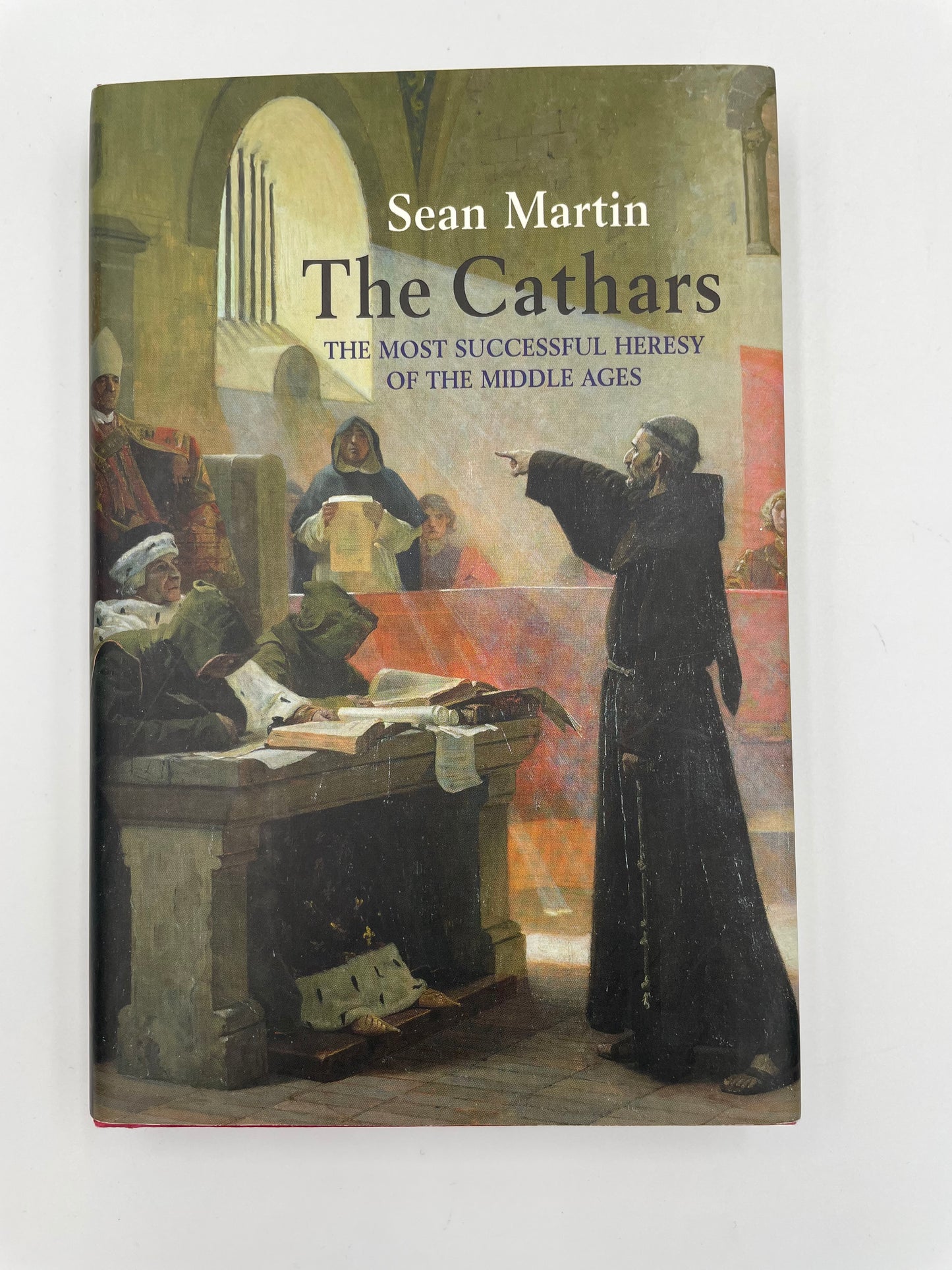 Book titled 'The Cathars: The Most Successful Heresy of the Middle Ages' by Sean Martin on a white background