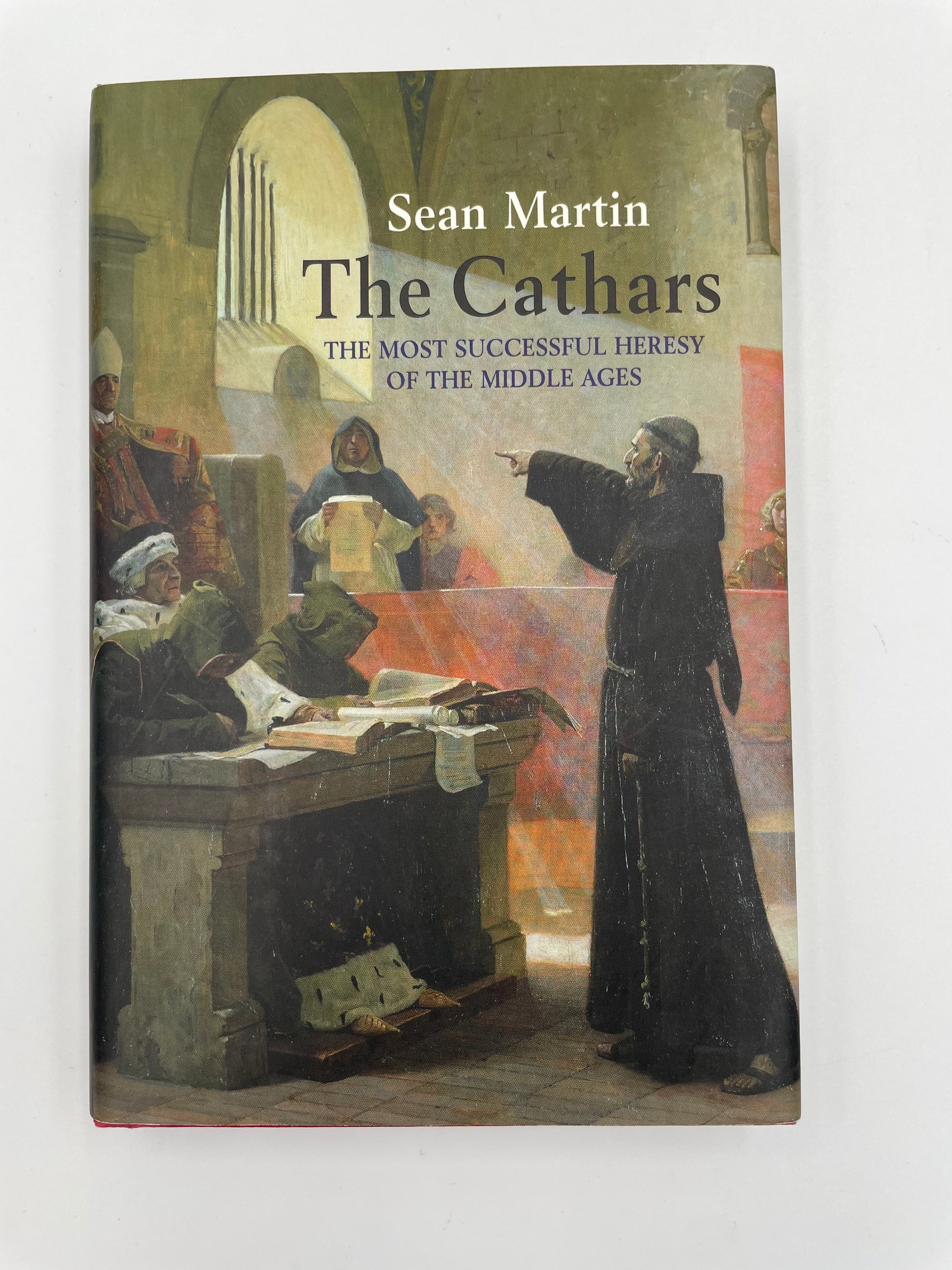 Book titled 'The Cathars: The Most Successful Heresy of the Middle Ages' by Sean Martin on a white background