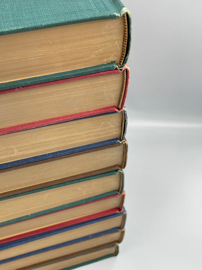 Books stacked with detailed view of good binding.