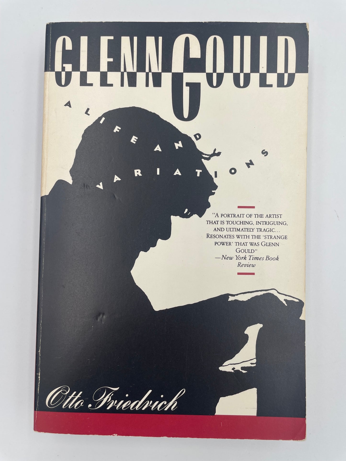 Book cover with silhouette design and text on a light gray background of 'Glenn Gould: A Life and Variations' by Otto Friedrich.