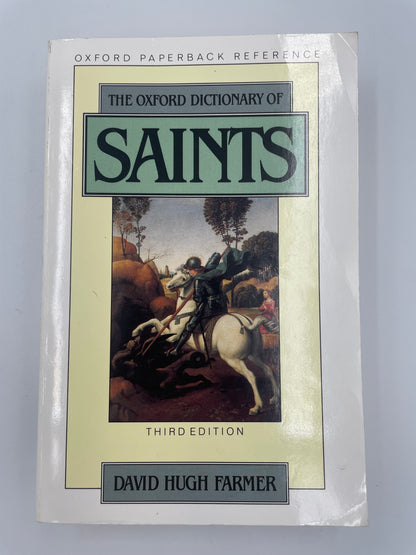Book cover of 'The Oxford Dictionary of Saints' by David Hugh Farmer on a gray background