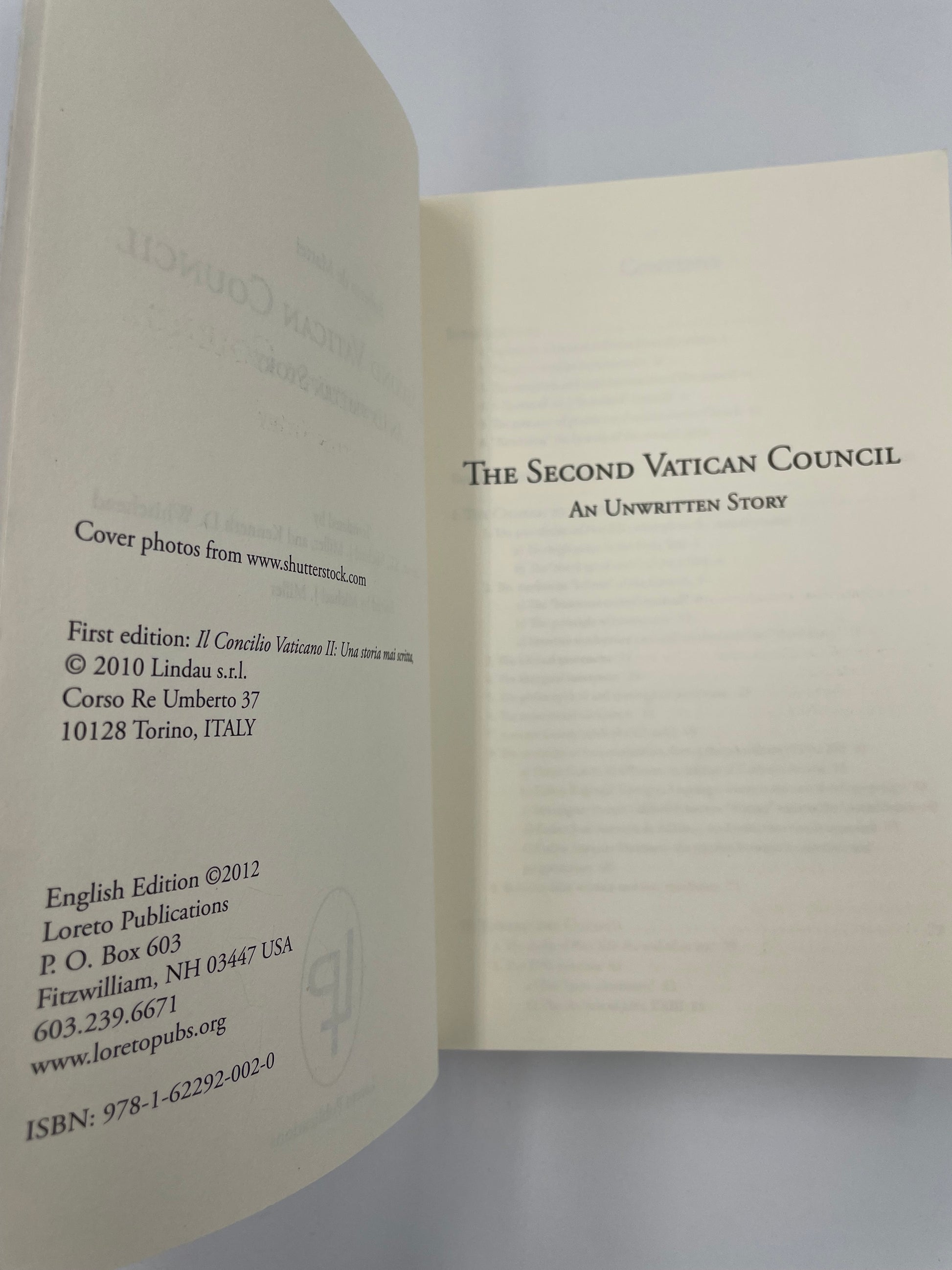 Open title page with text on a gray background