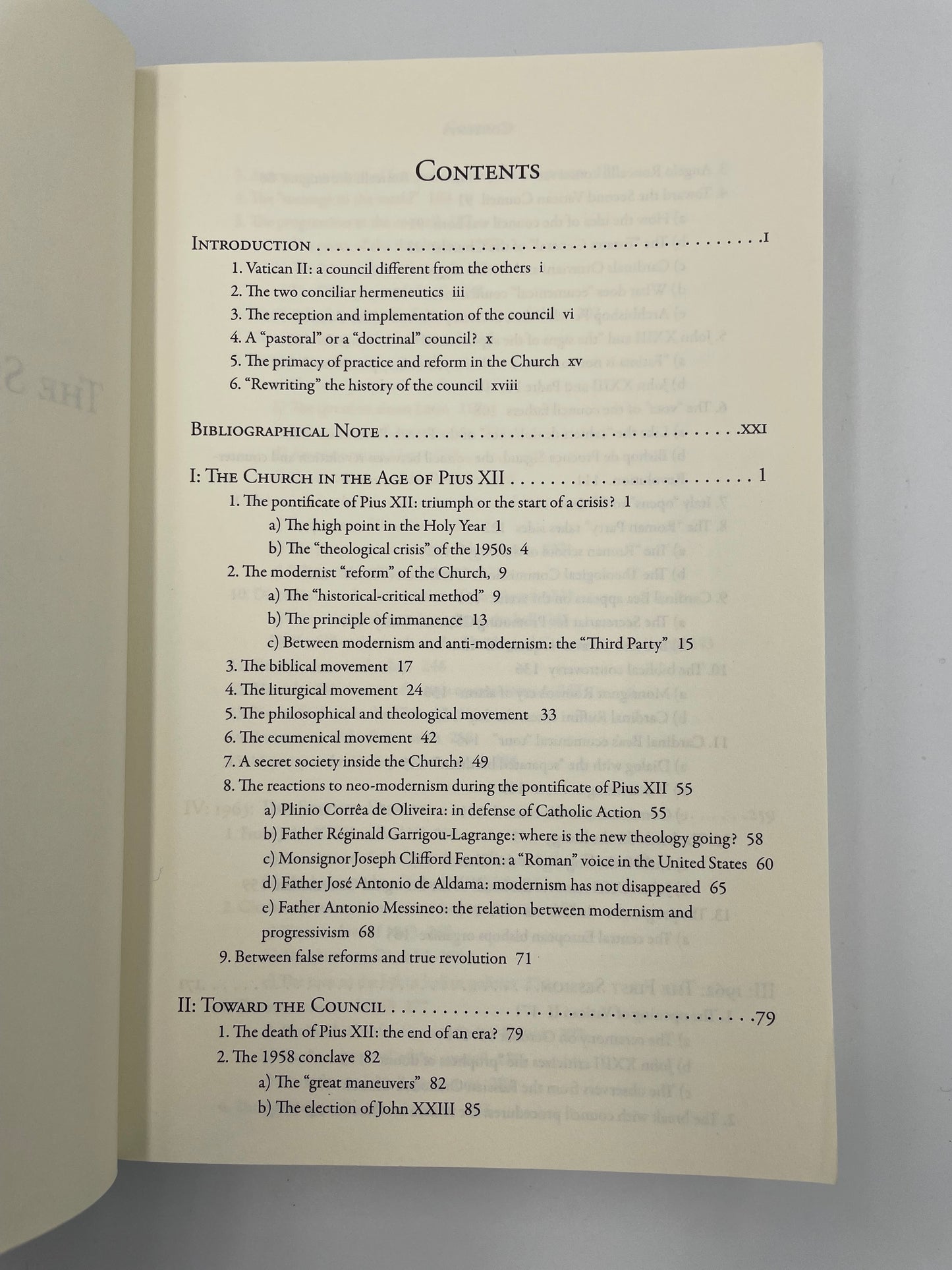 Open book showing a table of contents on a gray background