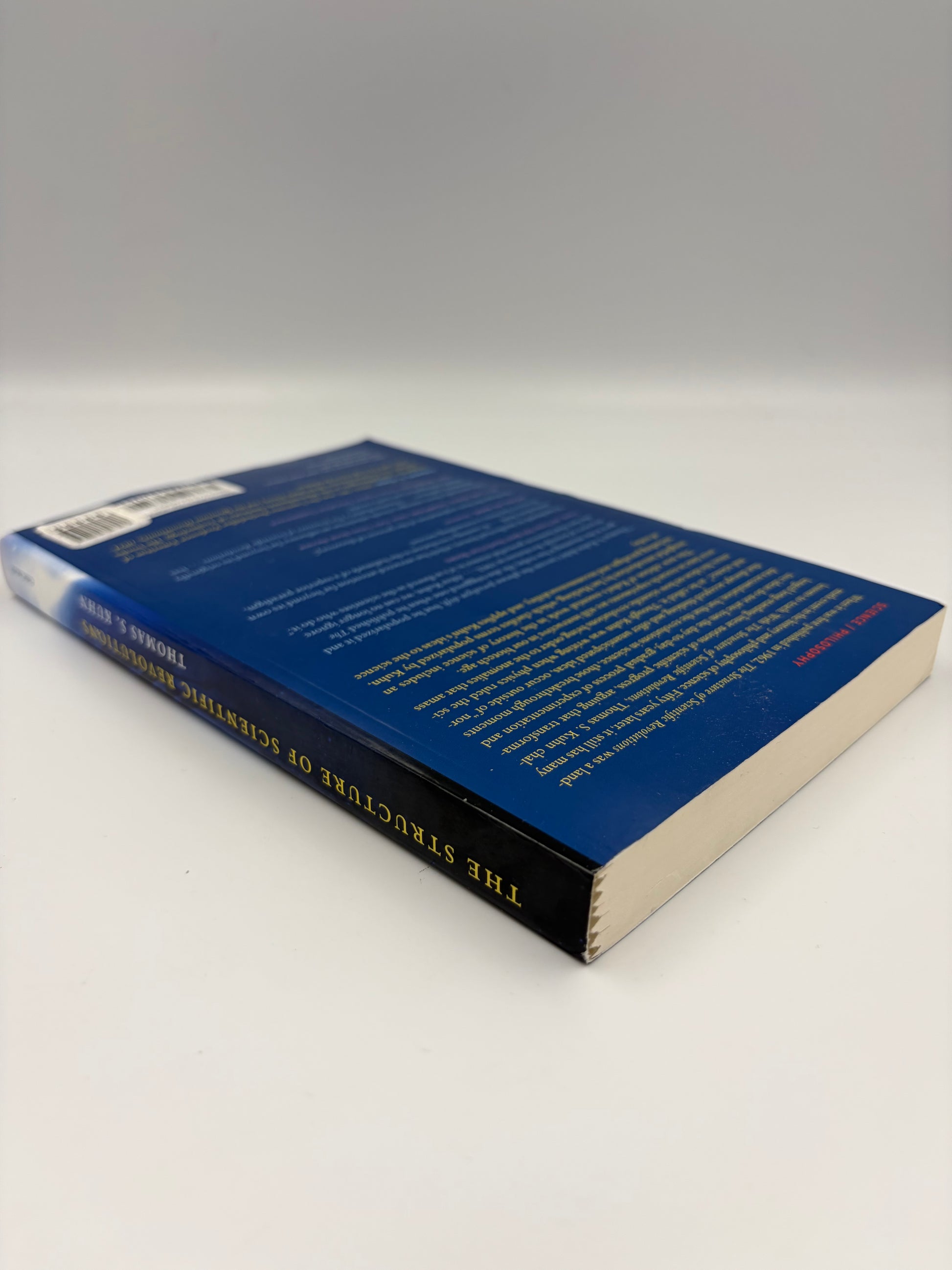 Back book cover with blue cover and yellow text on a white background.