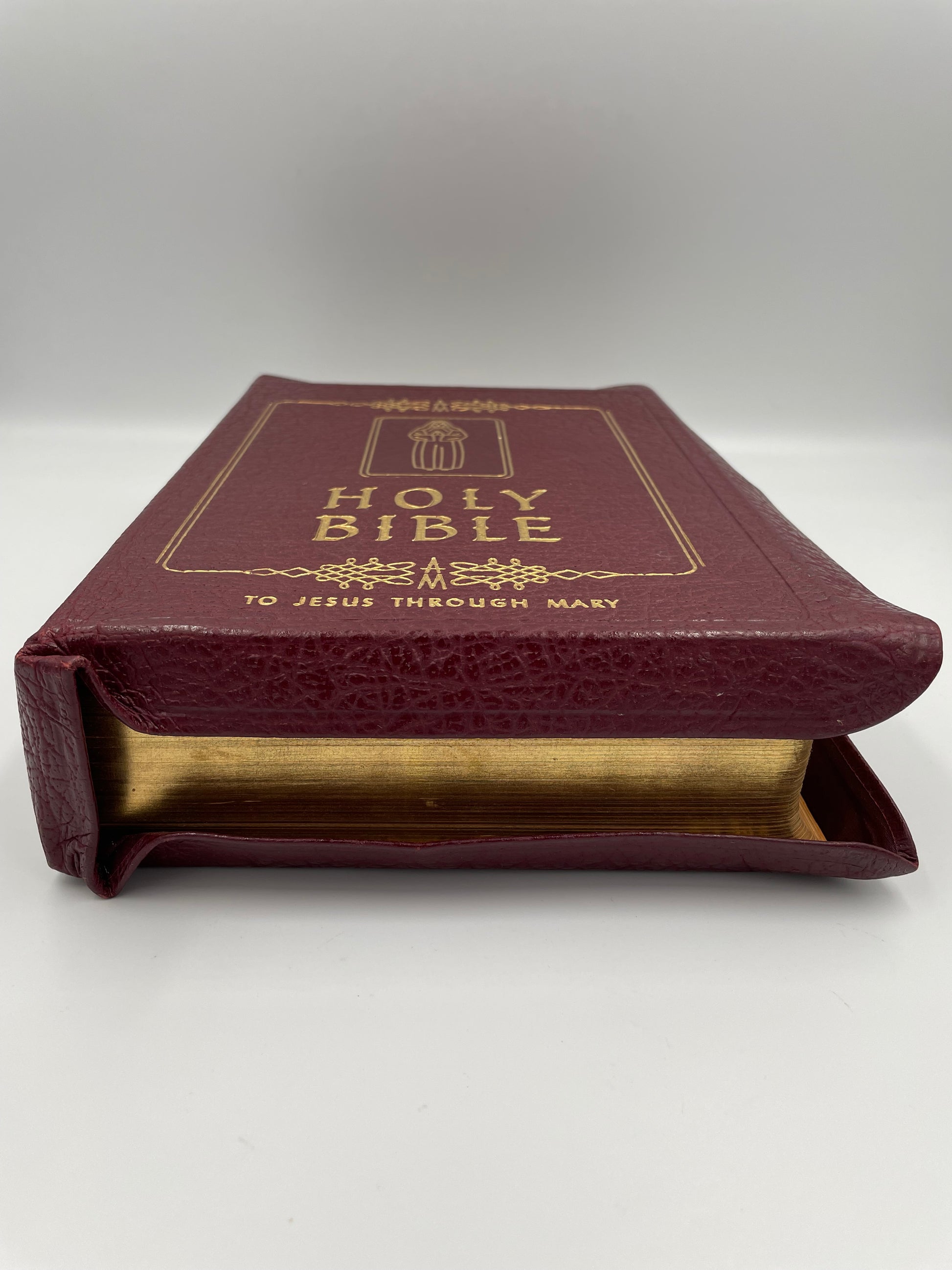 'The Marian Bible' with gold gilt edges.