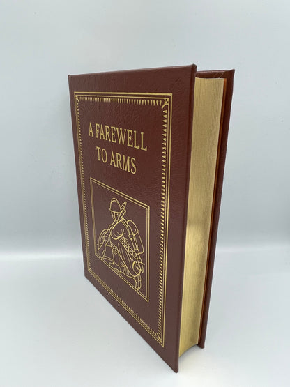 Book cover and gold gilded edges of ‘A farewell to Arms’ by Ernest Hemingway, Easton Press (2003)