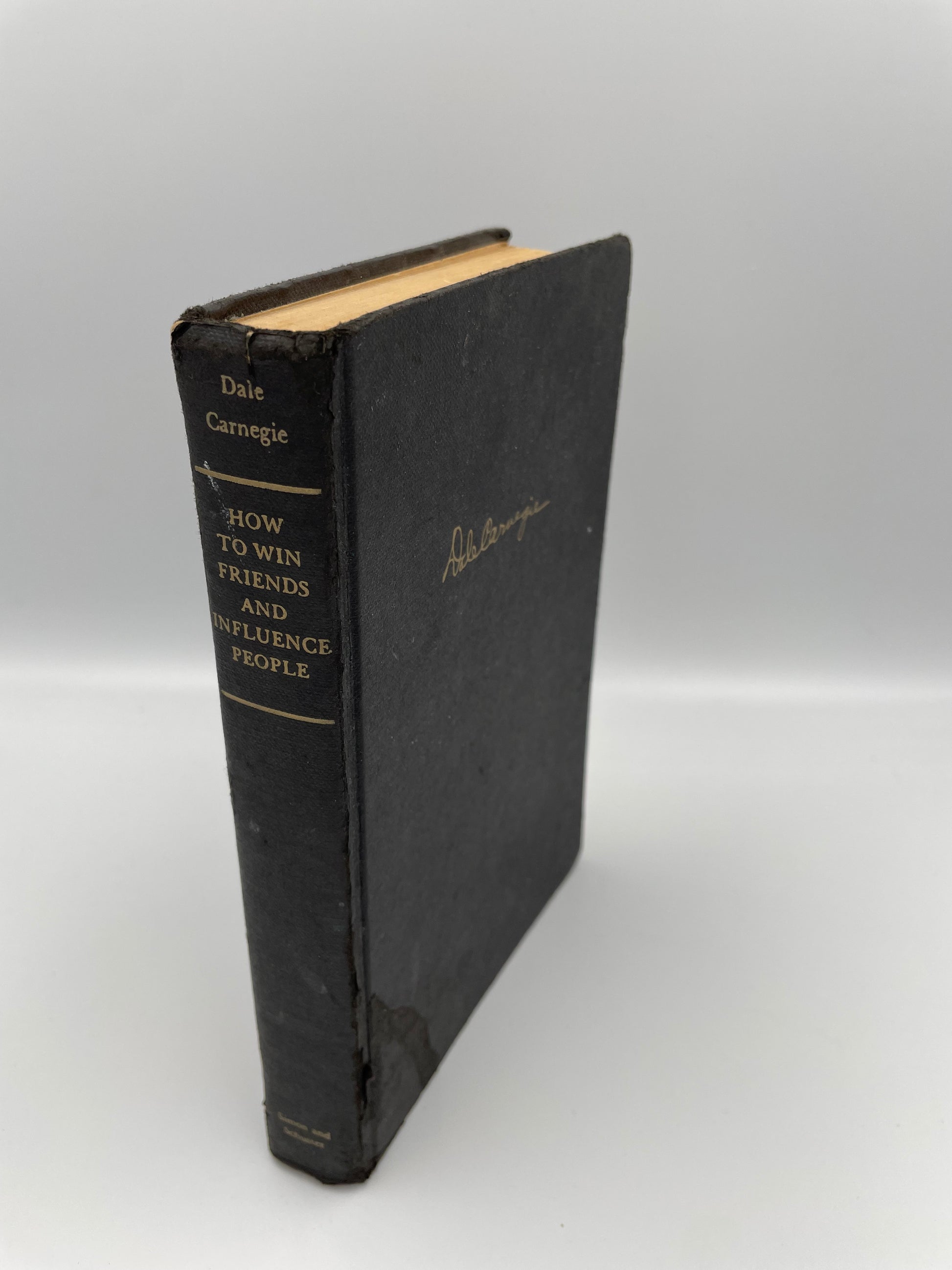 Book cover and spine of 'How to Win Friends and Influence People'  by Dale Carnegie, 1st Edition