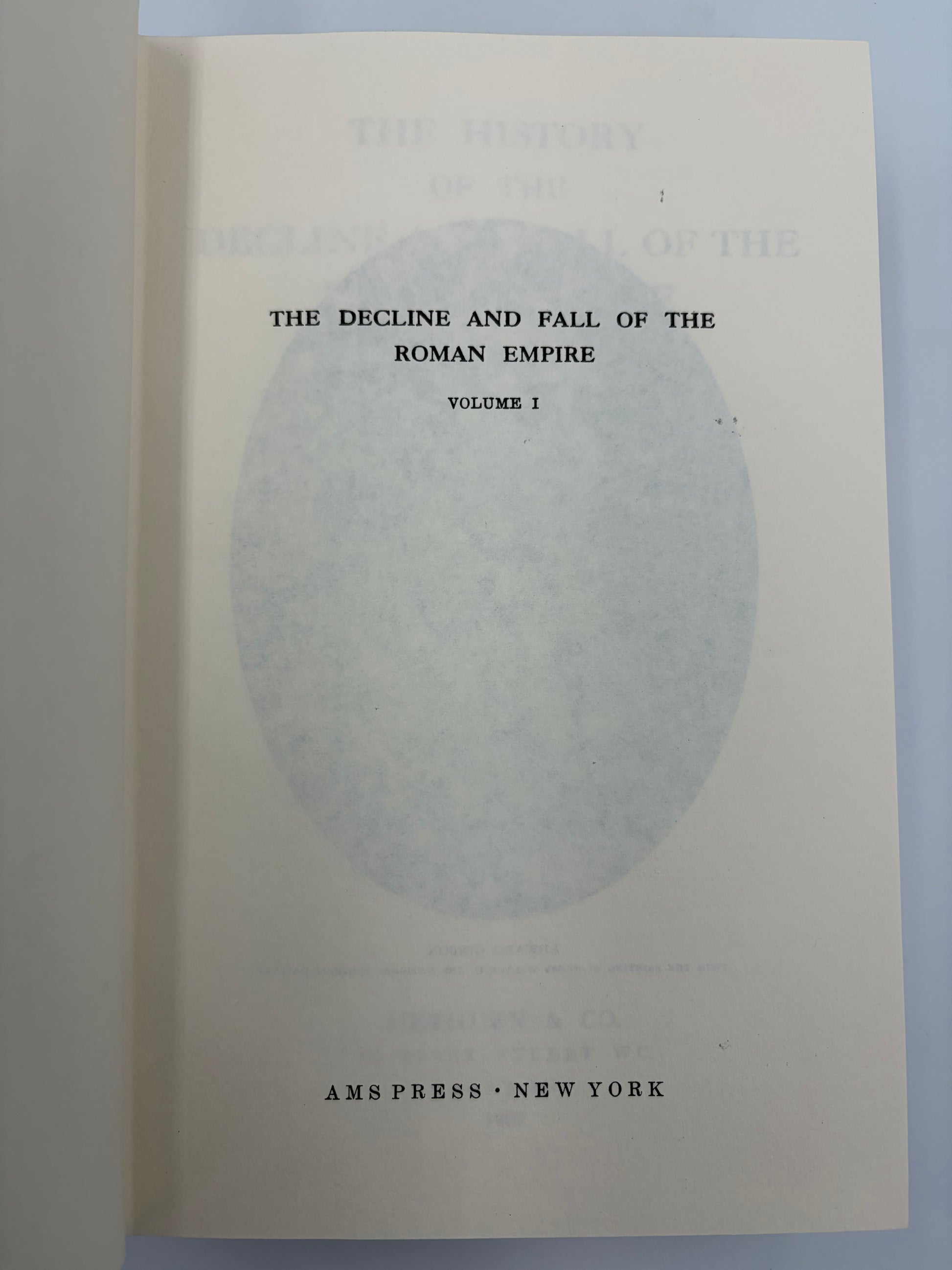 A book page from 'The Decline and Fall of the Roman Empire, Volume 1' showing the title and publisher 'Ams Press New York' on aged off-white paper.