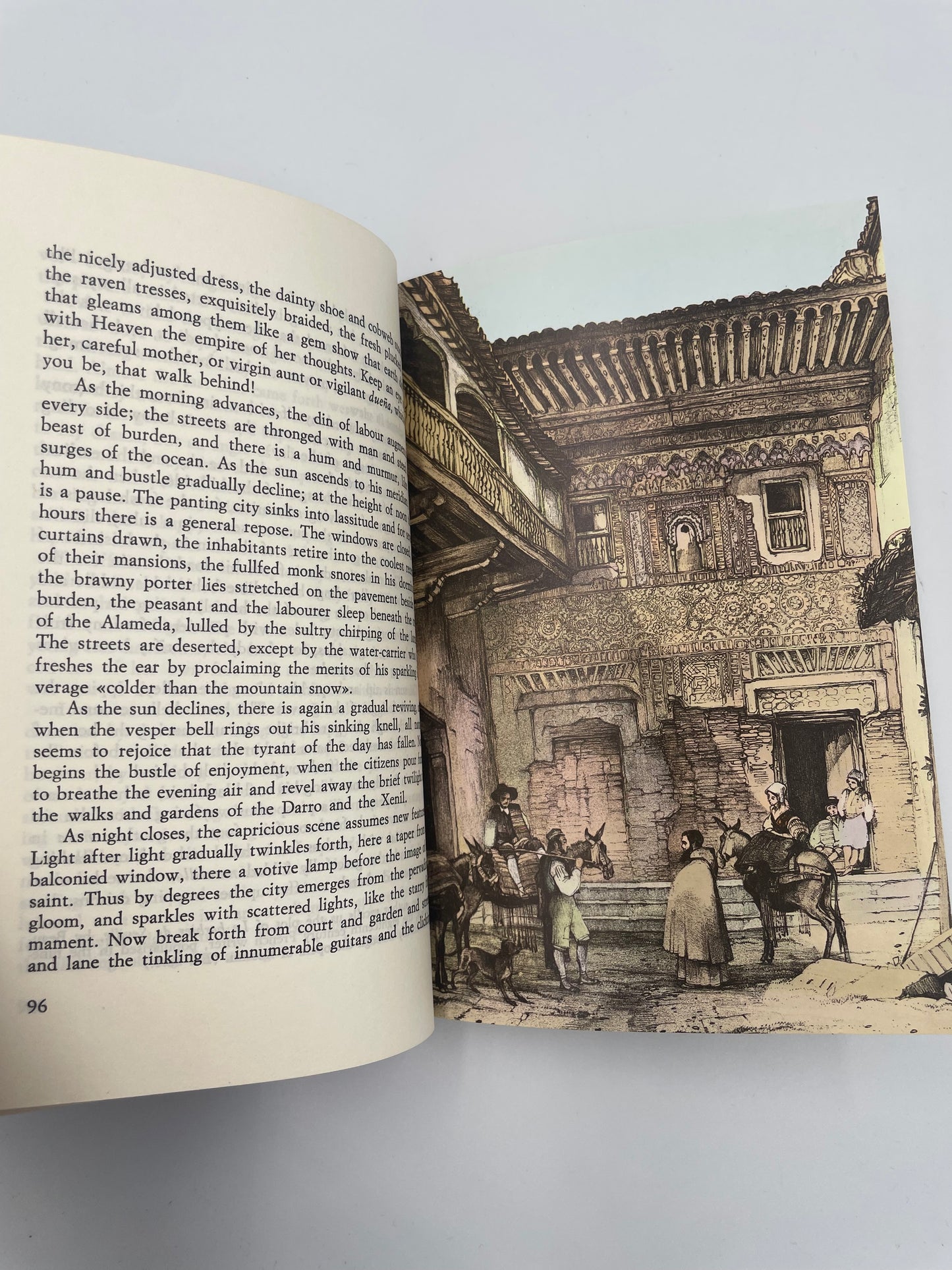 Random page 96 with text and 97 with illustration of locals in a street from 'Tales of the Alhambra' by Washington Irving.