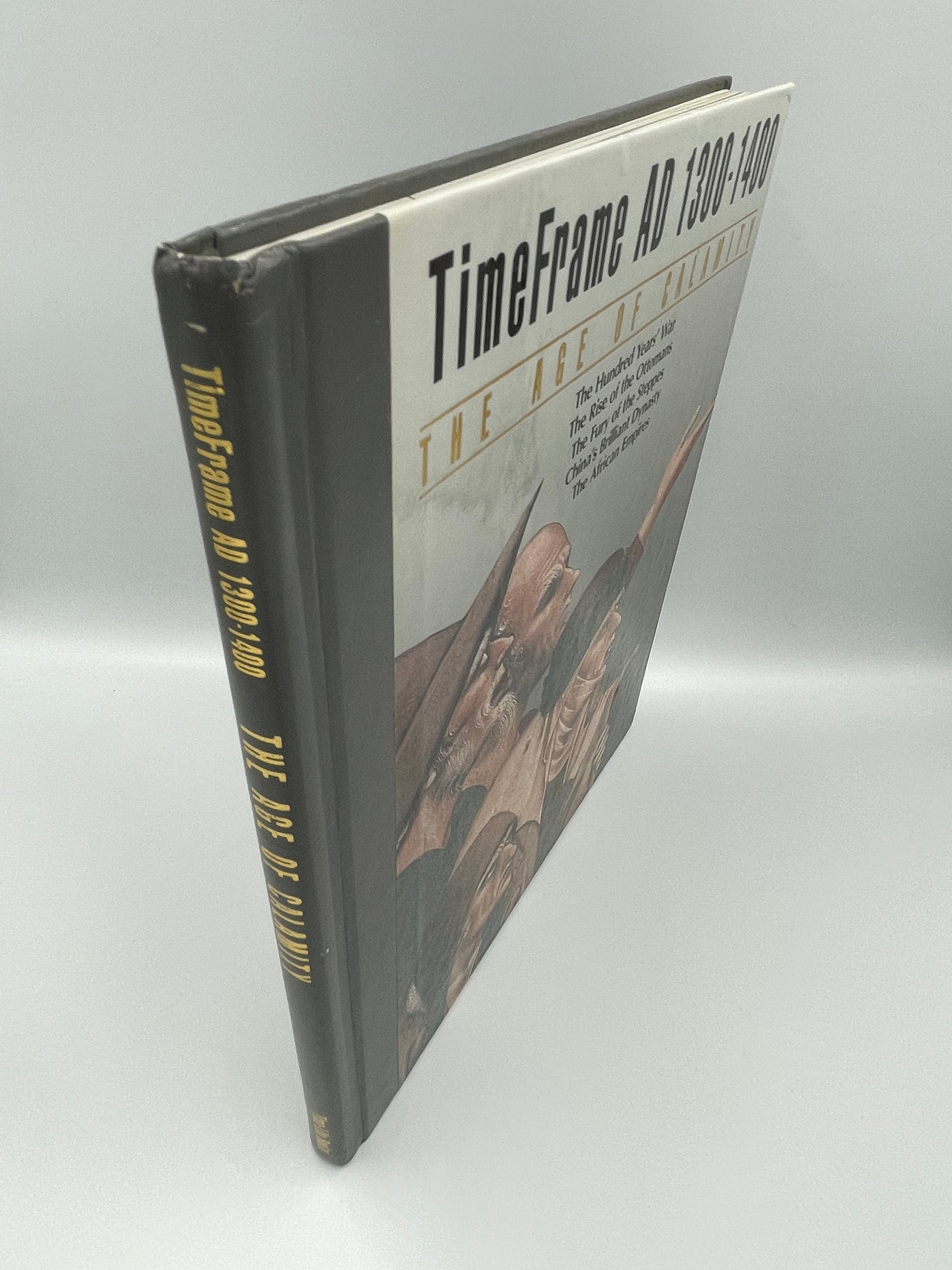 Book titled 'TimeFrame AD 1200-1400' on a reflective surface