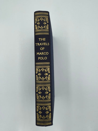 Elegant gold gilded book spine of "The Travels of Marco Polo the Venetian" (1948 edition). 