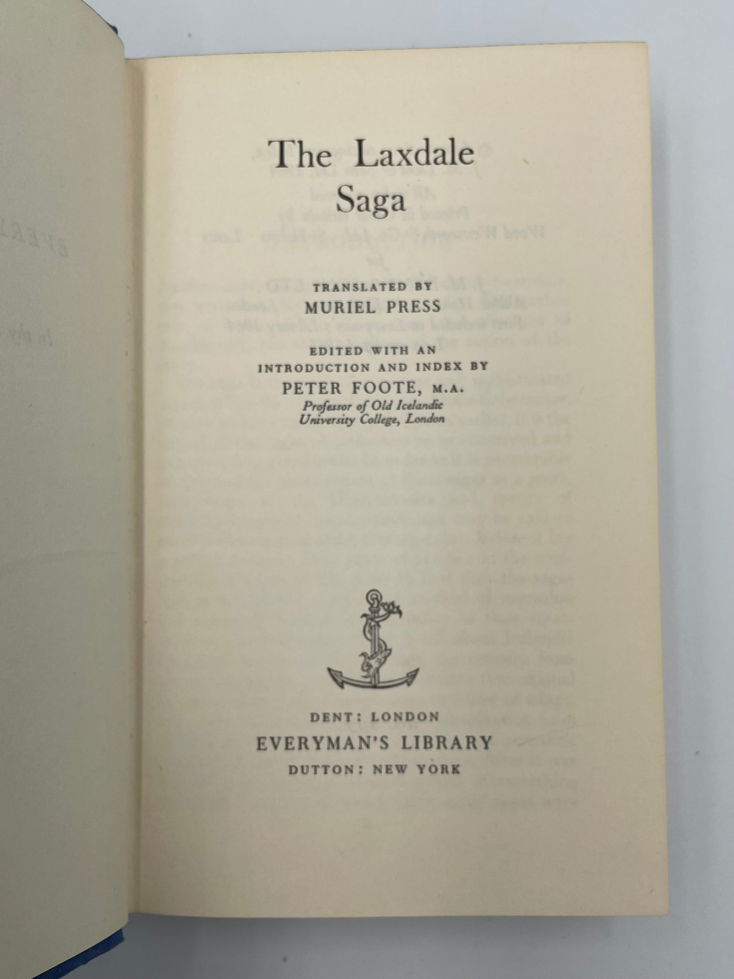 Title page of a book titled 'The Laxdale Saga' with text and an emblem on a plain background.