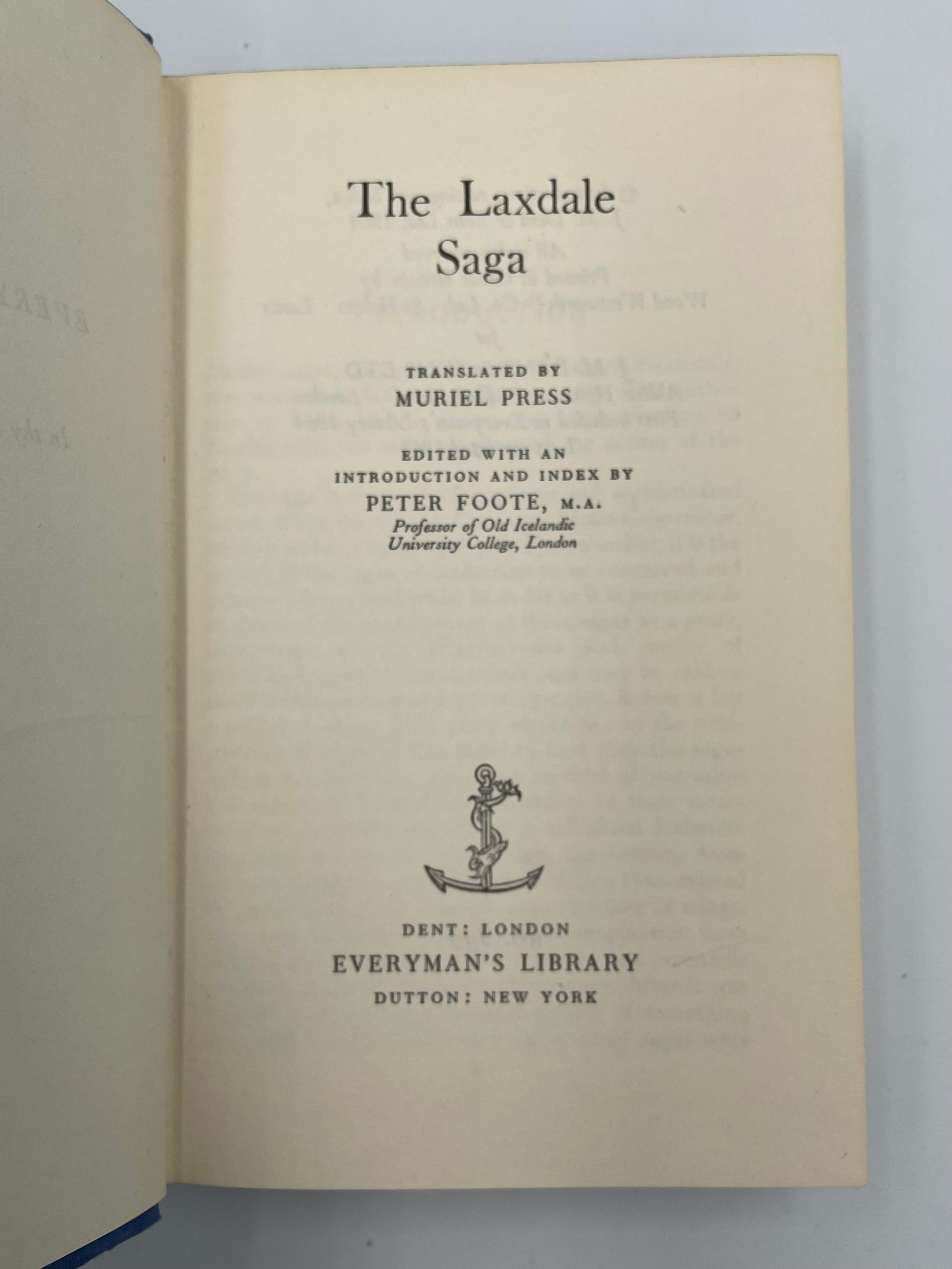 Title page of a book titled 'The Laxdale Saga' with text and an emblem on a plain background.