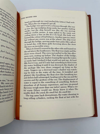 Random page with silk book mark of "The Sound and the Fury" by William Faulkner