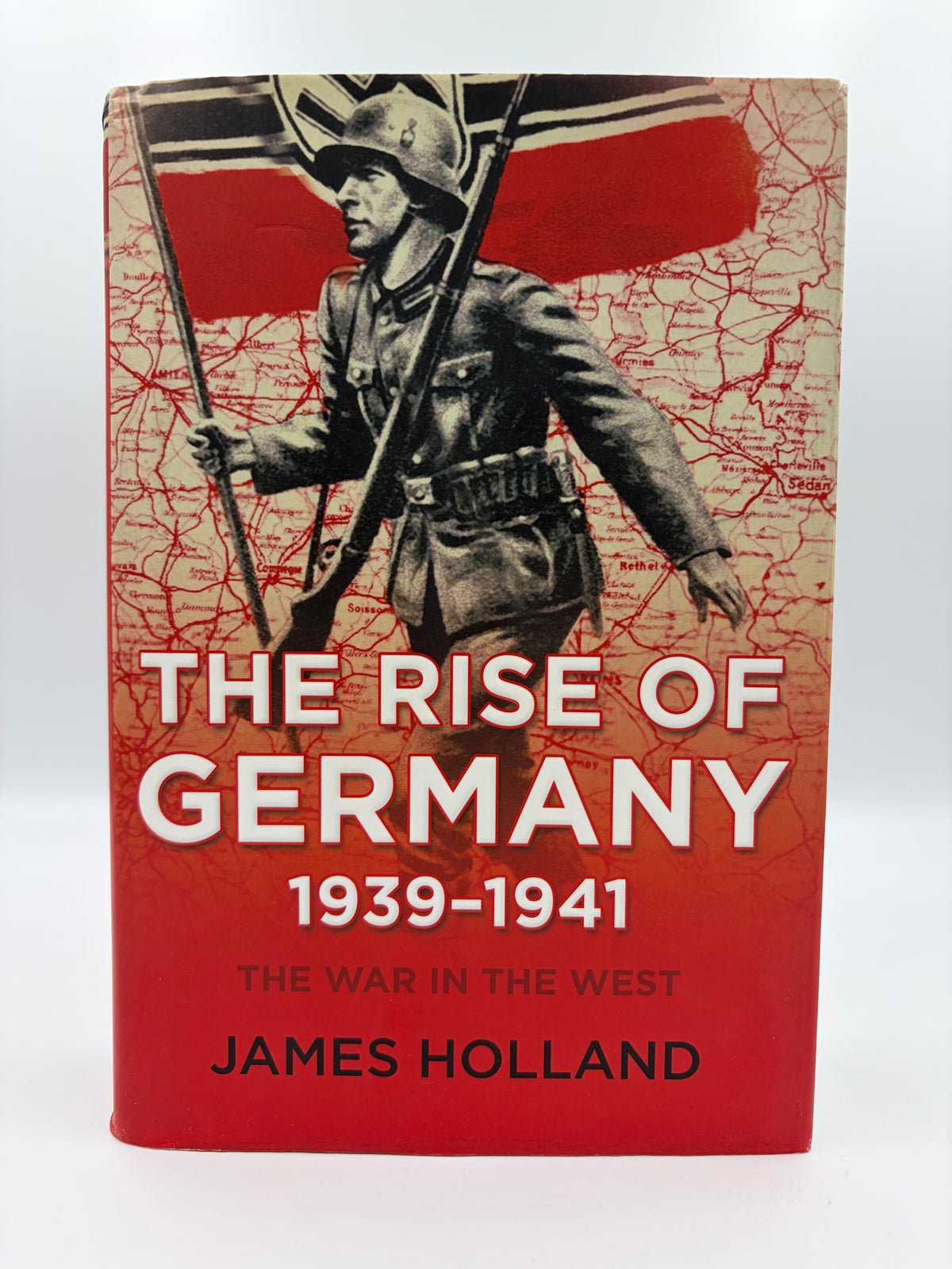 Book cover of 'The Rise of Germany 1939-1941  The war in the West' by James Holland, featuring a red and beige cover with an illustration of a German soldier carrying a flag.