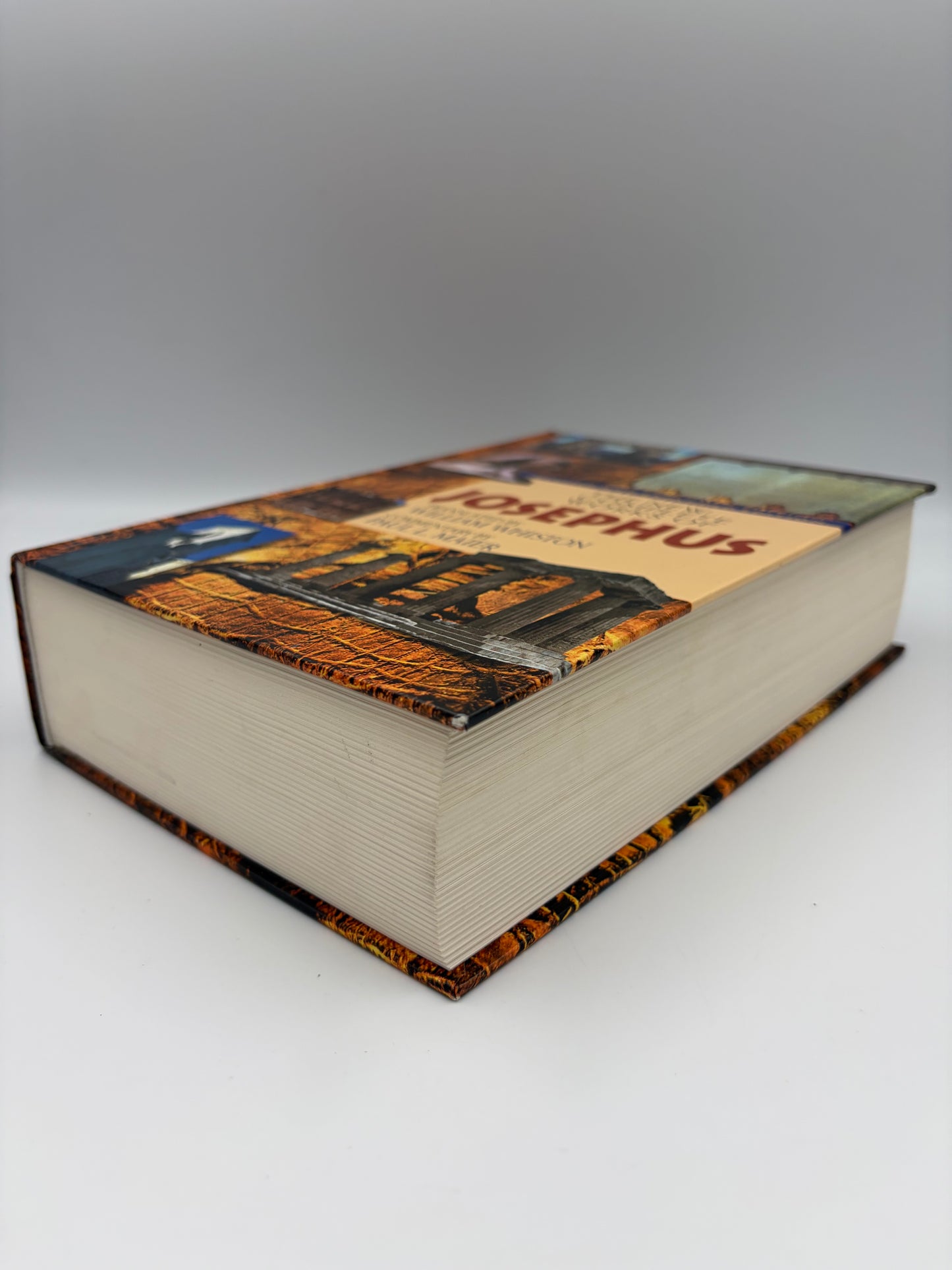 Book of Josephus' works with edge view and cover design on a white background