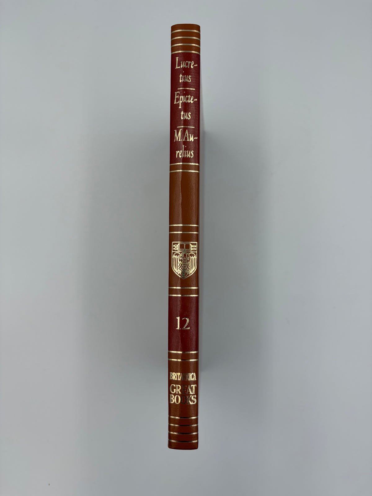 Elegant mid century book spine view of 'Lucretius, Epictetus and Marcus Aurelius'.