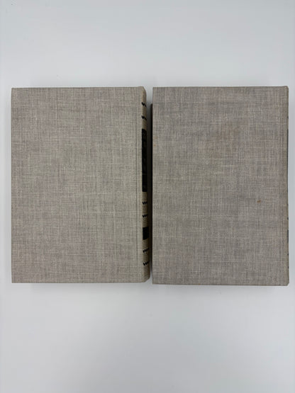 Two gray textured back book covers on a  white background.