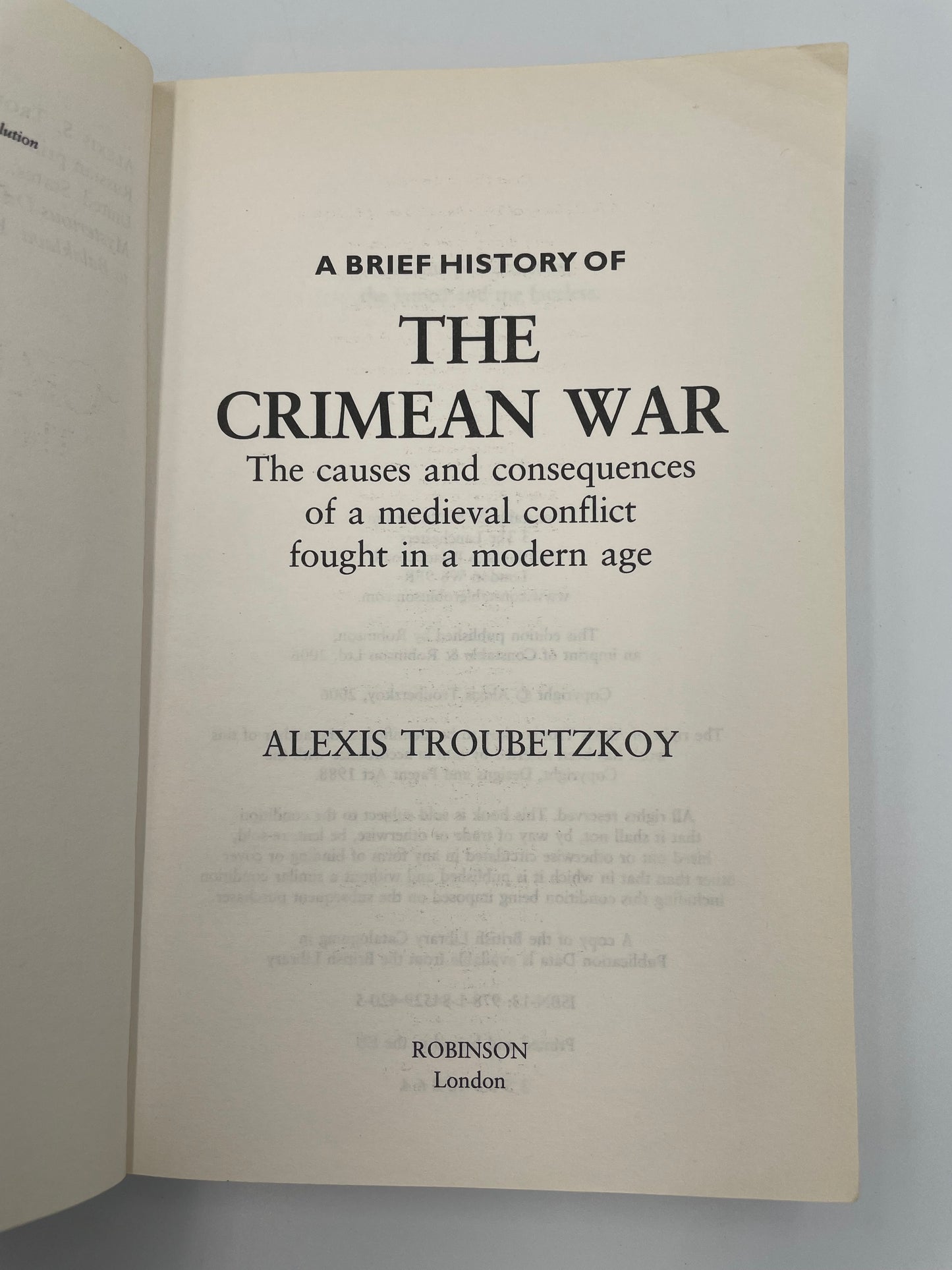 Book title page of 'A Brief History of the Crimean War' by Alexis Troubetzkoy on a gray background