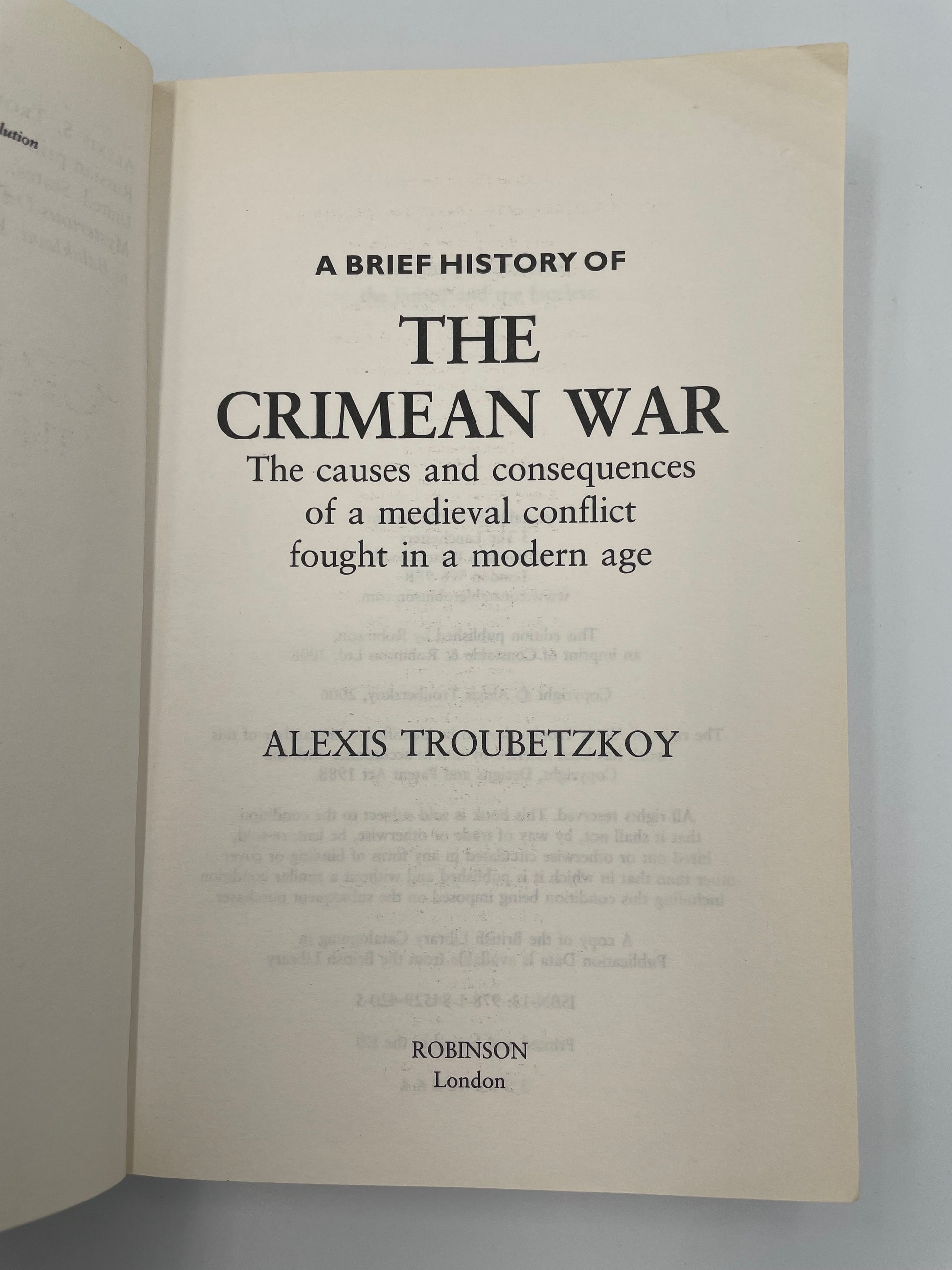 Book title page of 'A Brief History of the Crimean War' by Alexis Troubetzkoy on a gray background