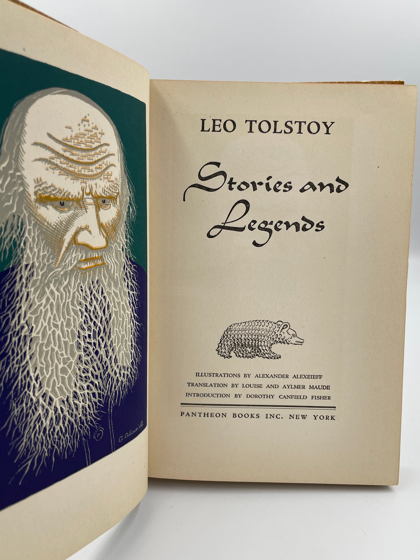 Book title page of 'Stories and Legends' by Leo Tolstoy with an illustration of Tolstoy on a white background.