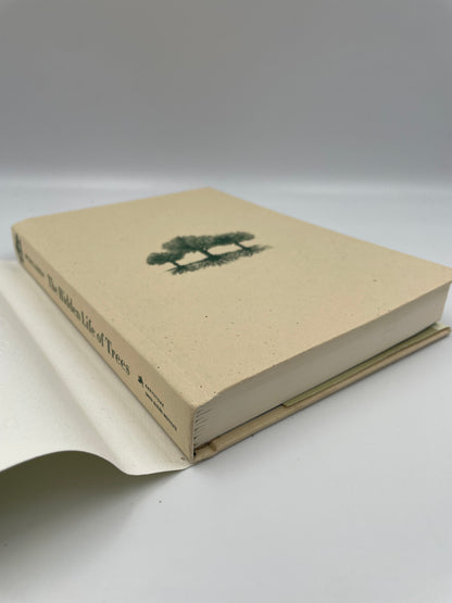 Book cover of 'The Hidden Life of Trees' by Peter Wohlleben without the dust jacket. 