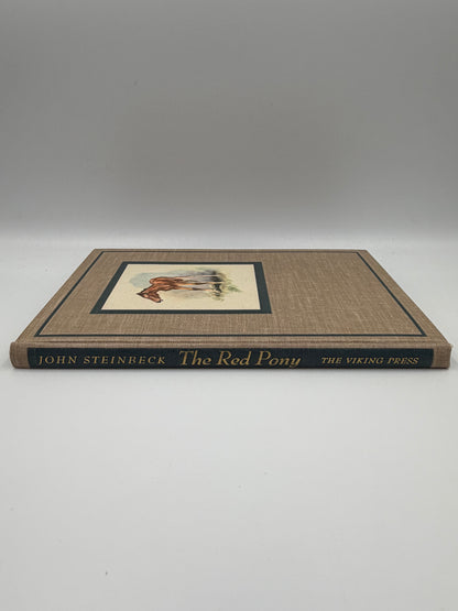 Book spine view of the book, 'The Red Pony' by John Steinbeck.