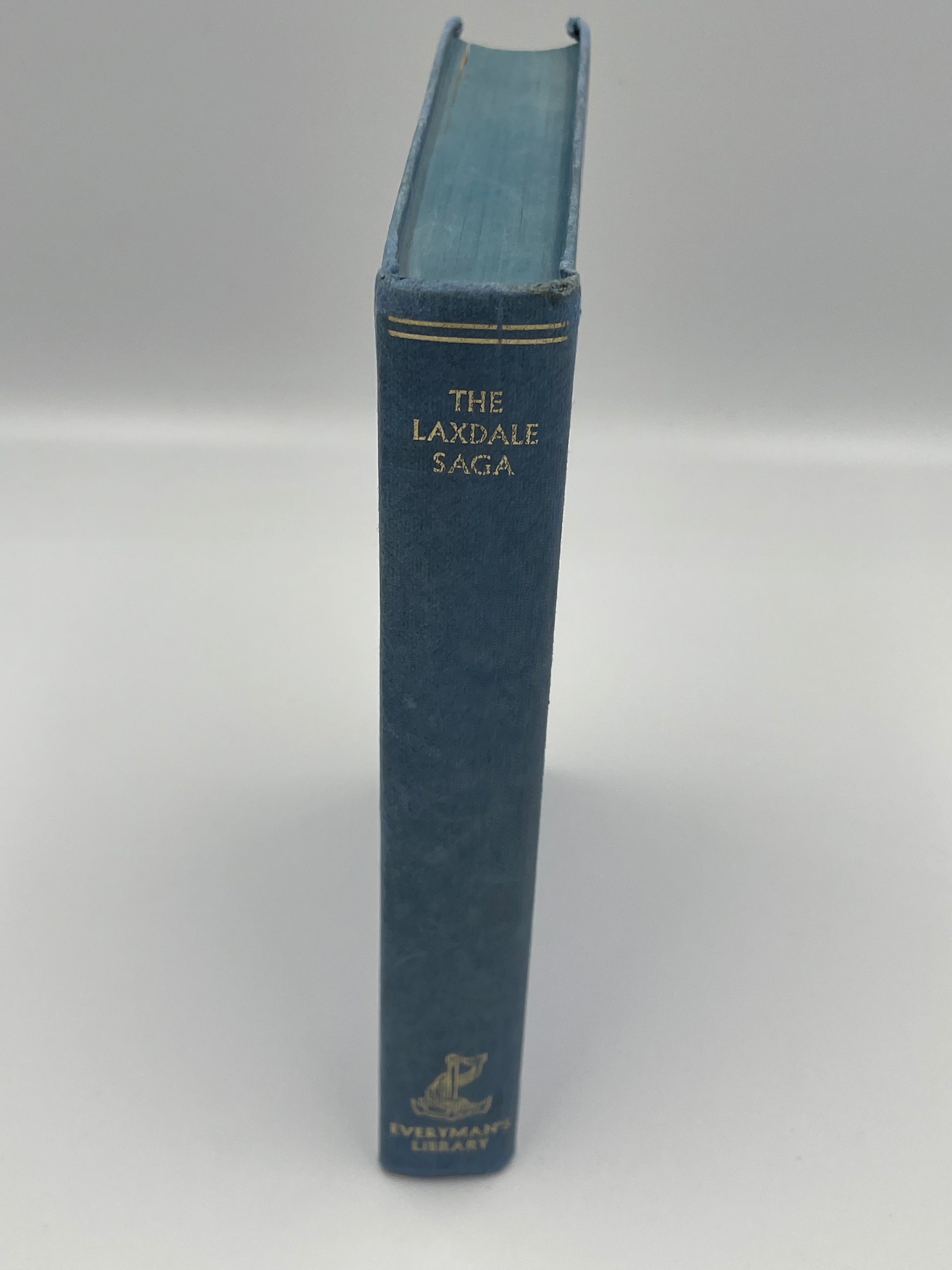 Blue book titled 'The Laxdale Saga' on a white background