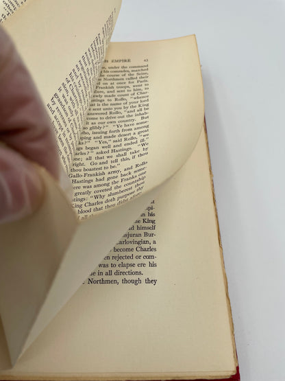 Image of old fashioned uncut page 43  with gloved collector's hand turning the pages from "The Great Events by Famous Historians" 1905 Edition (Volumes 1 to 18)