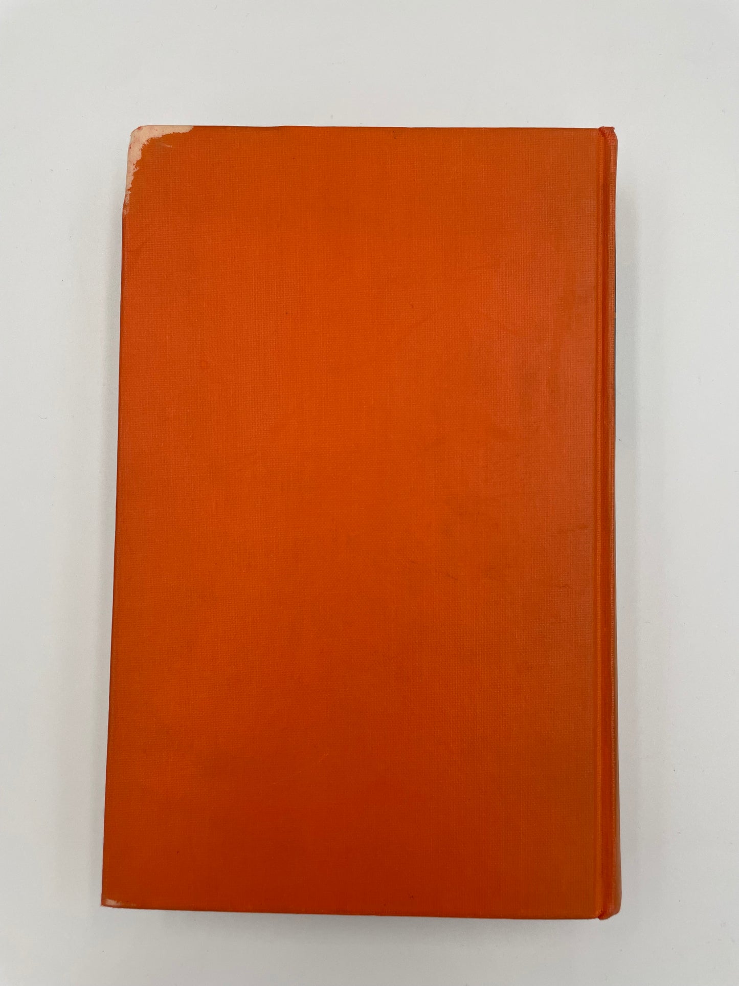 Plain orange back book cover on a white background