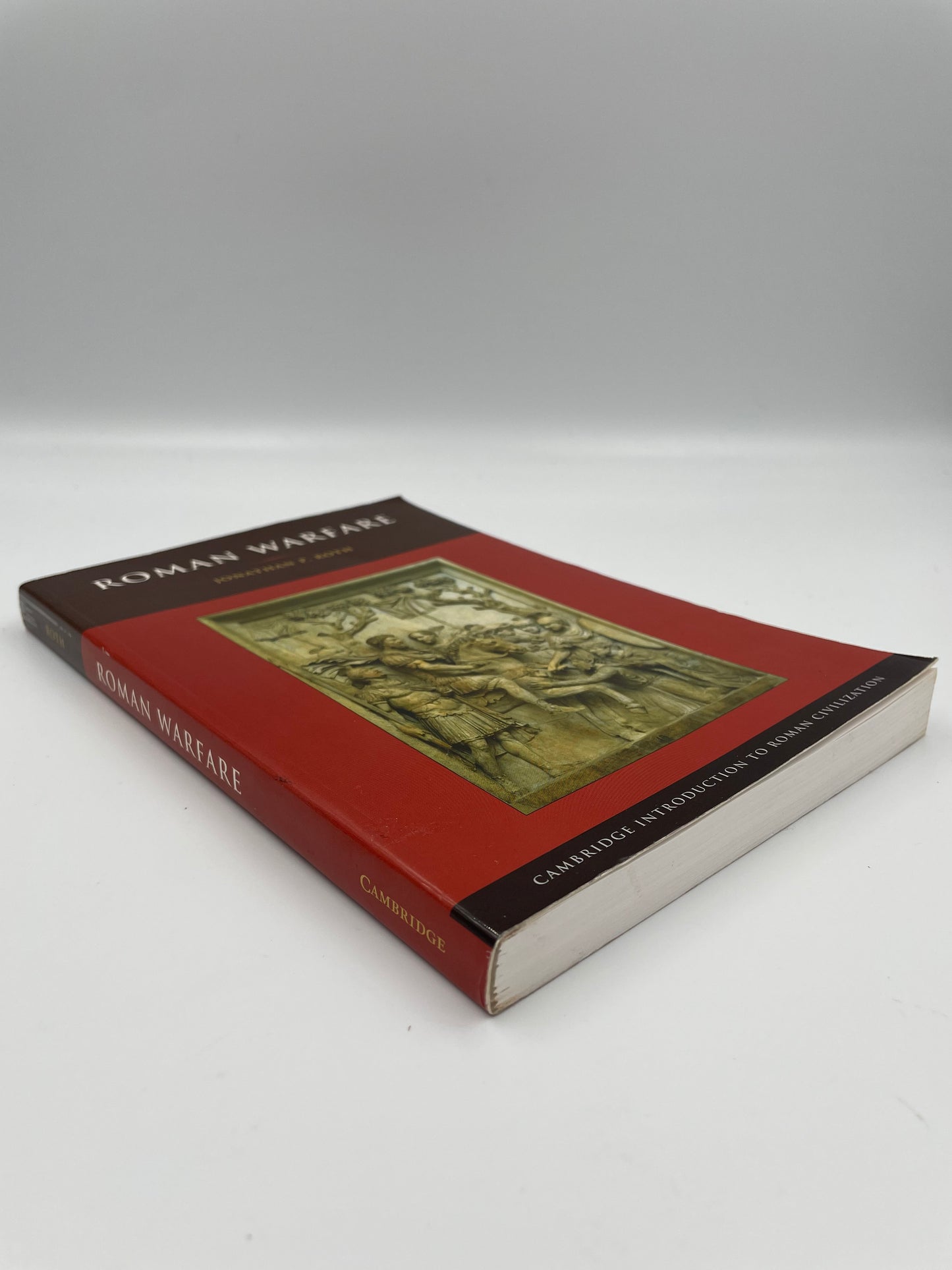 Book cover and spine view of ‘Roman Warfare’ by Jonathan P. Roth.