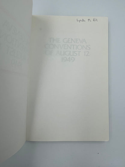 Insed page with previous owner's name from Book covers of "The Geneva Conventions of August 12 1949" AND "Protocols additional to the Geneva Convention of 12 August 1949"
