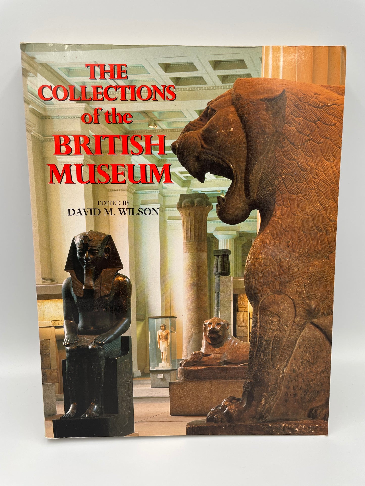 Book cover of 'The Collections of the British Museum' with statues in the foreground.