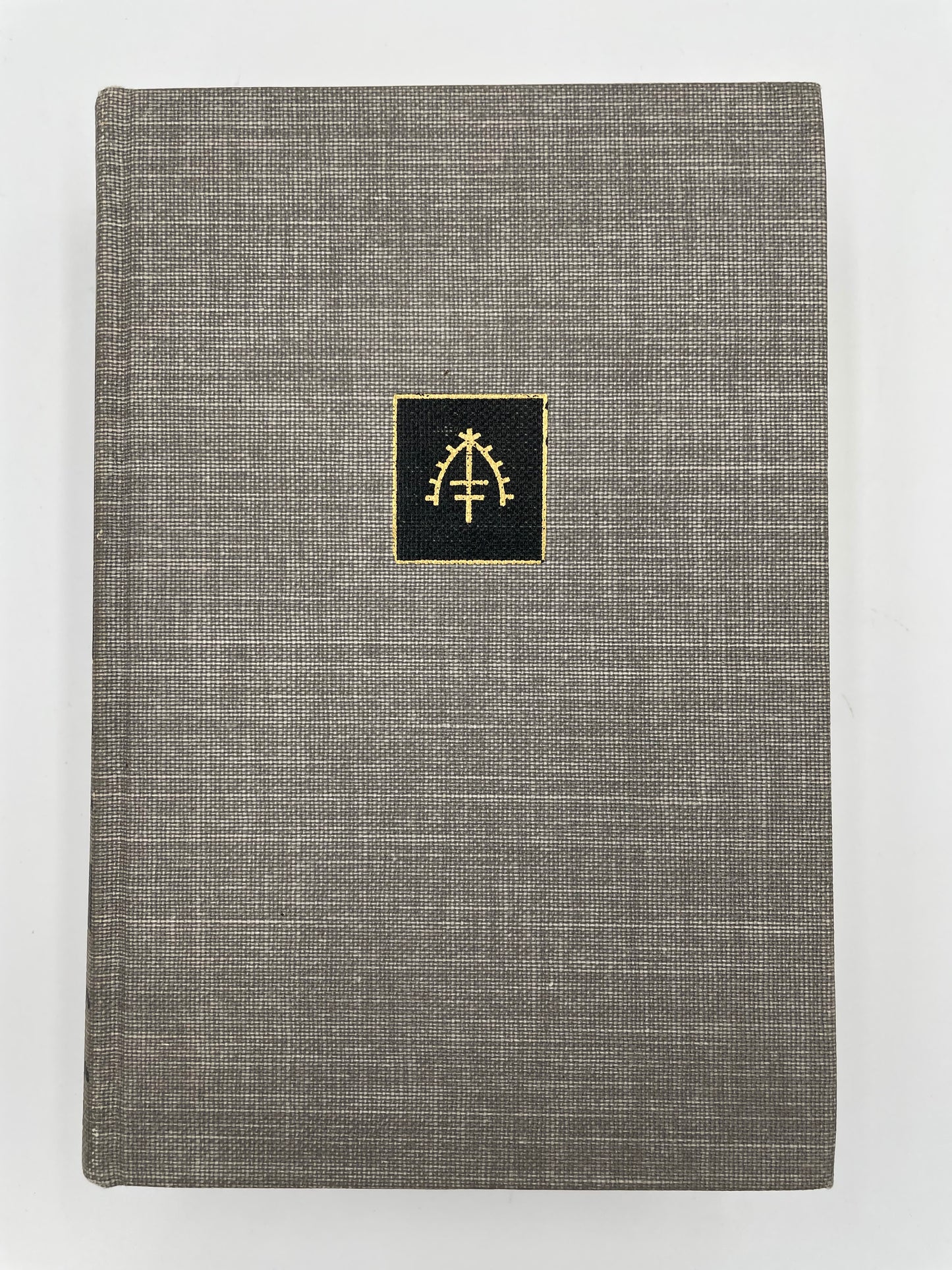 Book cover of, 'The Complete Short Stories of W. Somerset Maugham Volume 2 – The World Order'. with gray textured fabric with a gold emblem on a white background.
