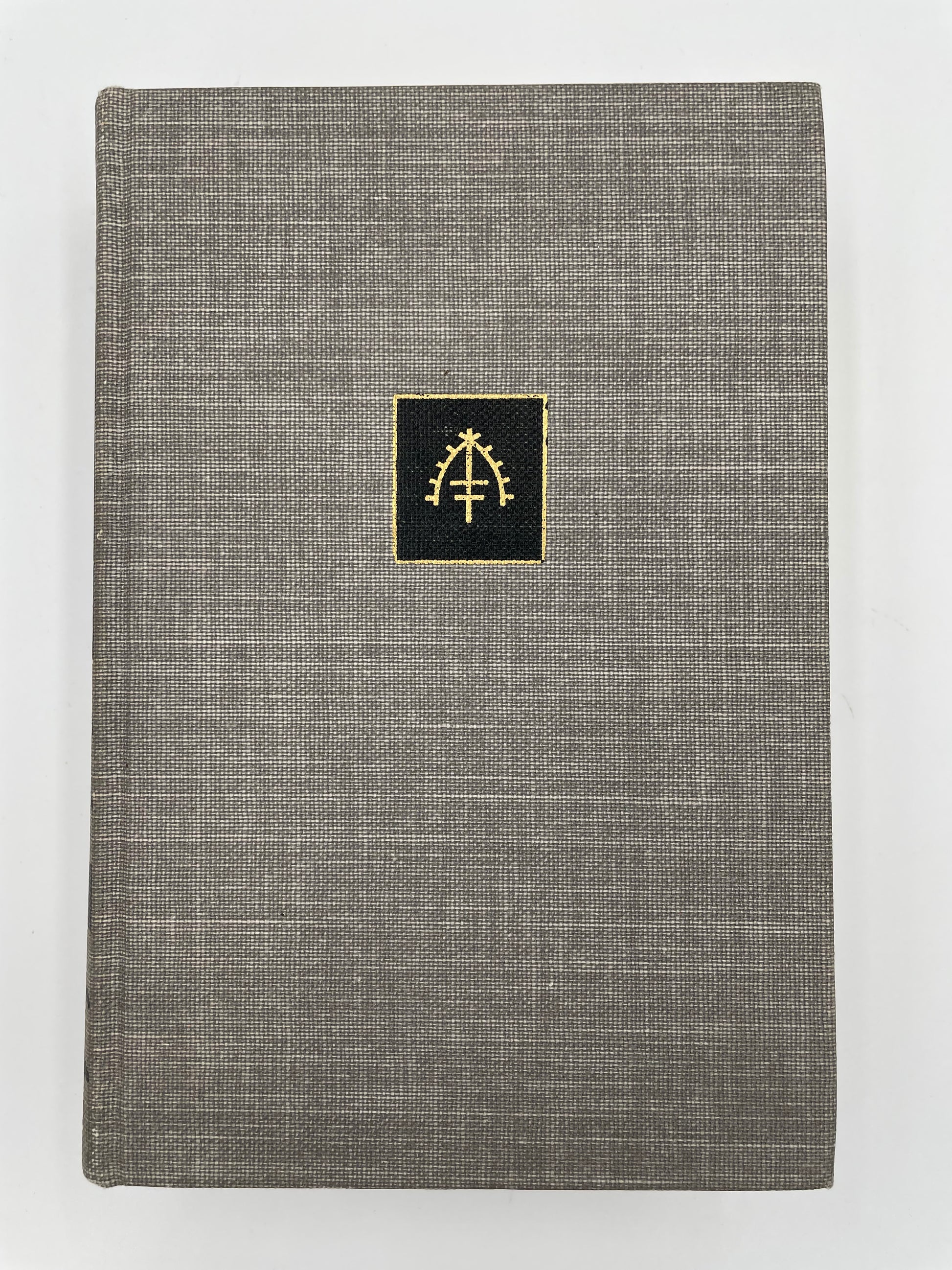 Book cover of, 'The Complete Short Stories of W. Somerset Maugham Volume 2 – The World Order'. with gray textured fabric with a gold emblem on a white background.