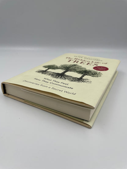 Book with a tree illustration on a white background.
