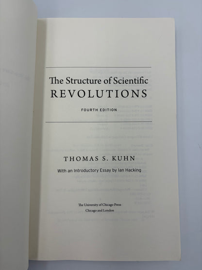 Titlel page from, 'The Structure of Scientific Revolutions' by Thomas S. Kuhn on a light gray background.