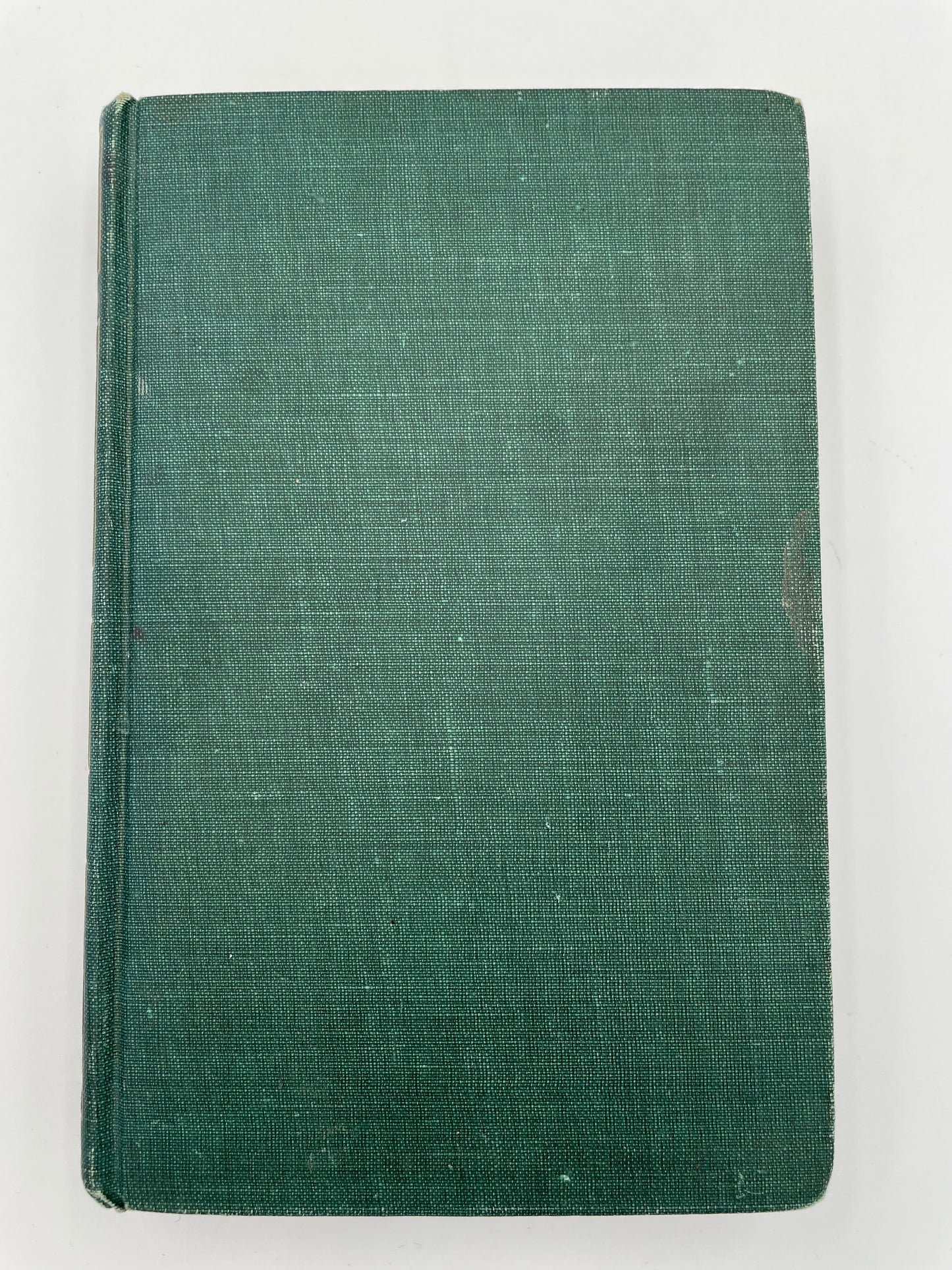 Green fabric book cover on a white background