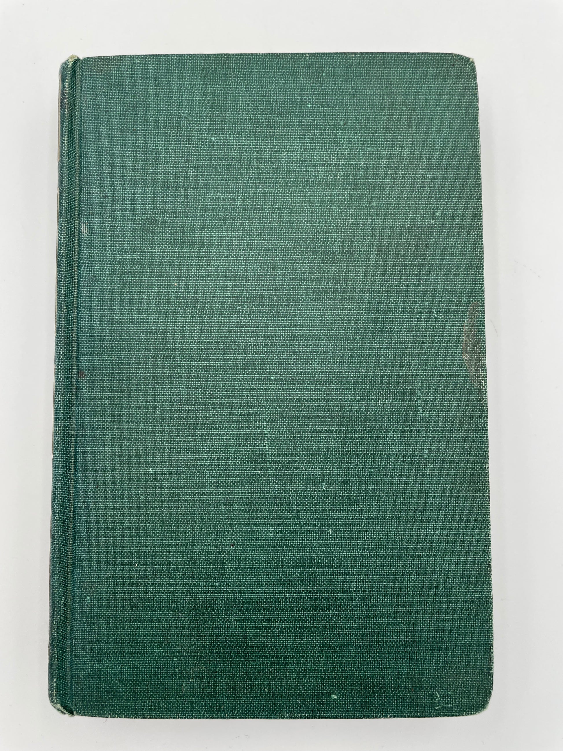 Green fabric book cover on a white background