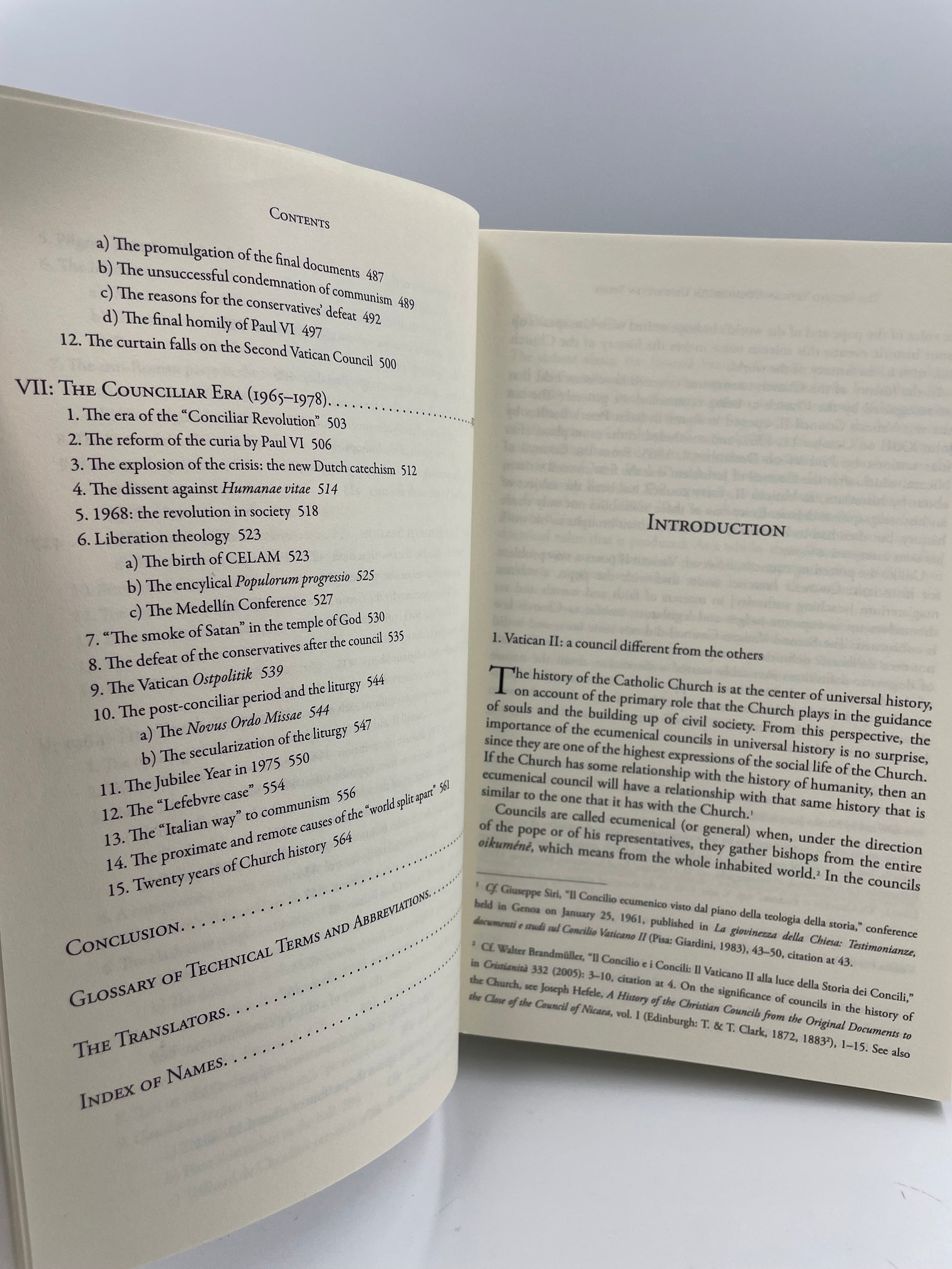 Open book with contents page and intro  on a white background