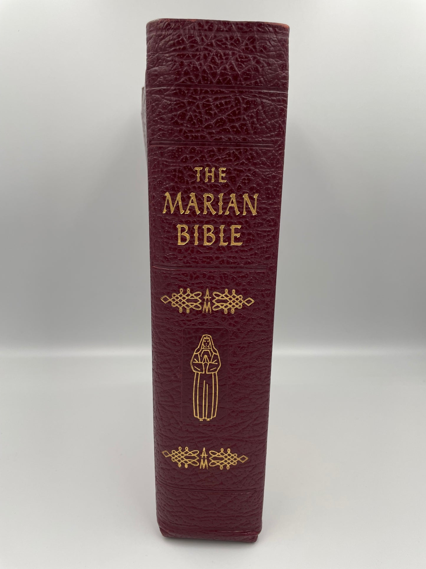 Leather bound bible  titled 'The Marian Bible' (spine view) 