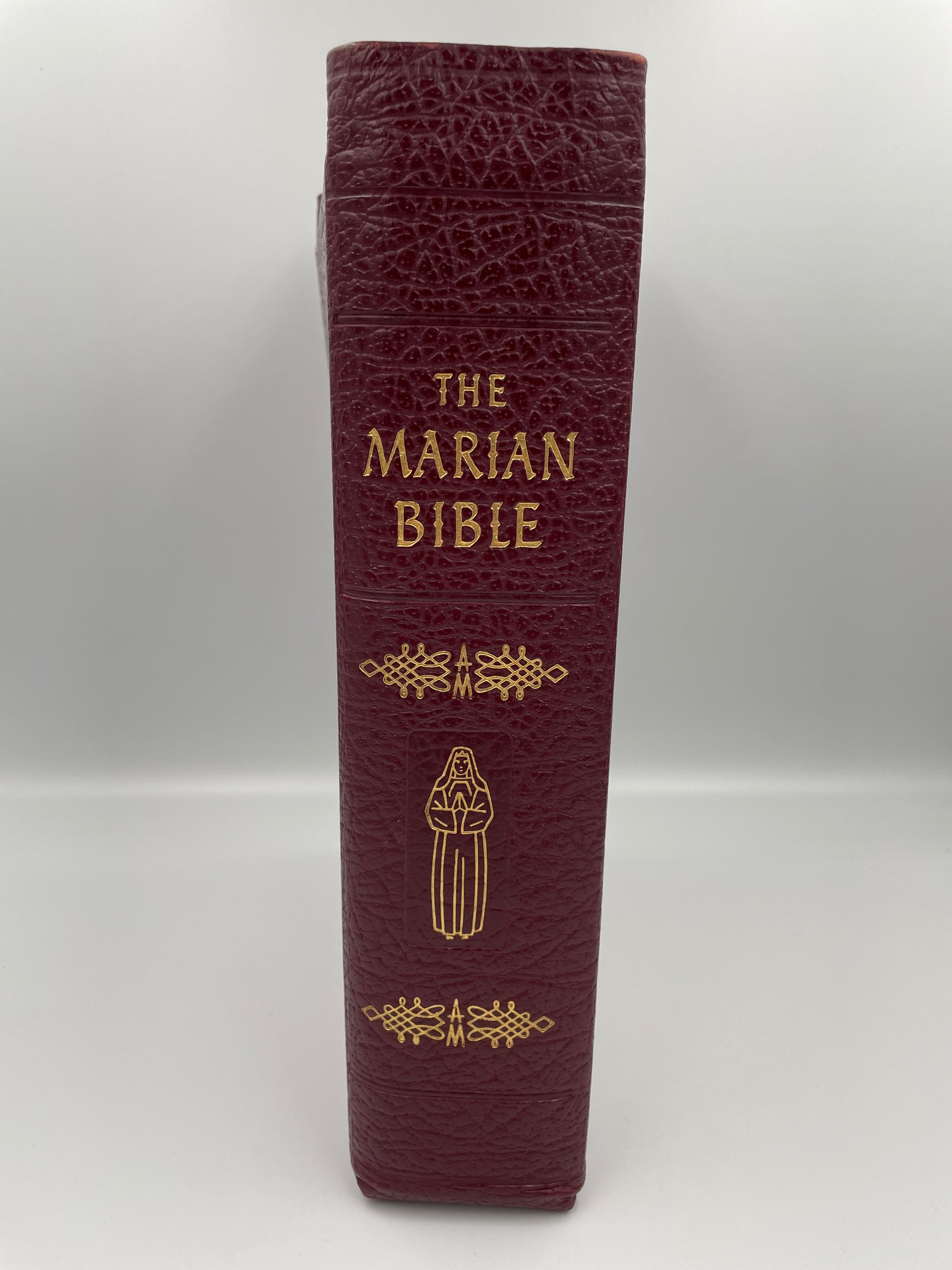 Leather bound bible  titled 'The Marian Bible' (spine view) 