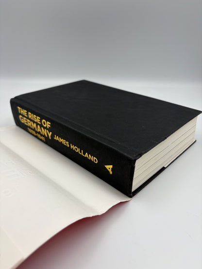 A hardcover book titled 'The Rise of Germany 1939-1941  The war in the West' featuring a black cloth-bound spine with gold lettering, resting on a white surface with its dust jacket fanned out.