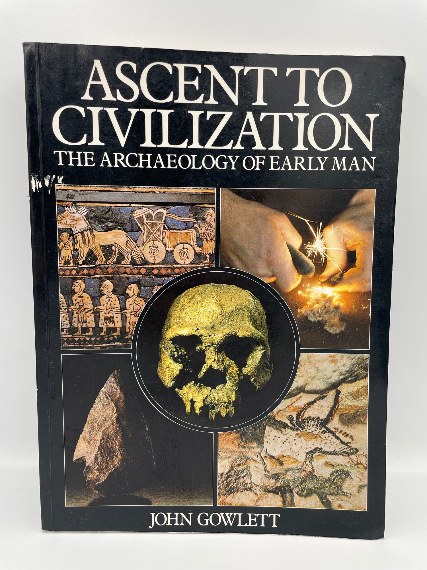 Book titled 'Ascent to Civilization: The Archaeology of Early Man' by John Gowlett on a white background