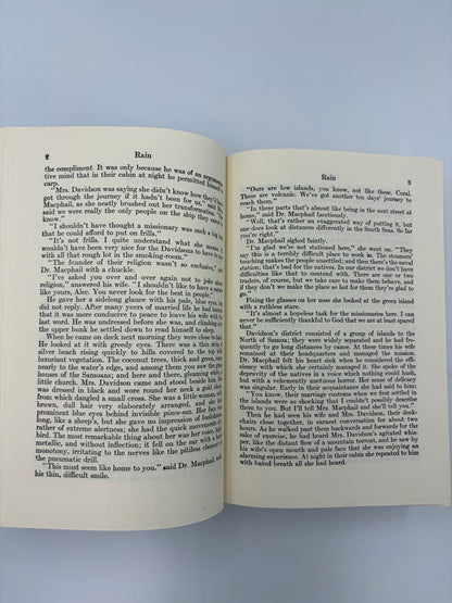 Open book with text continued form short story, 'The Rain' from 'The Complete Short Stories of W. Somerset Maugham' volume 1.