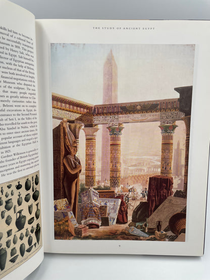 Open book with a detailed illustration of a architectural scene on a gray background from ‘Egyptology: An Introduction to the History, Culture, and Art of Ancient Egypt’ by James Putnam.
