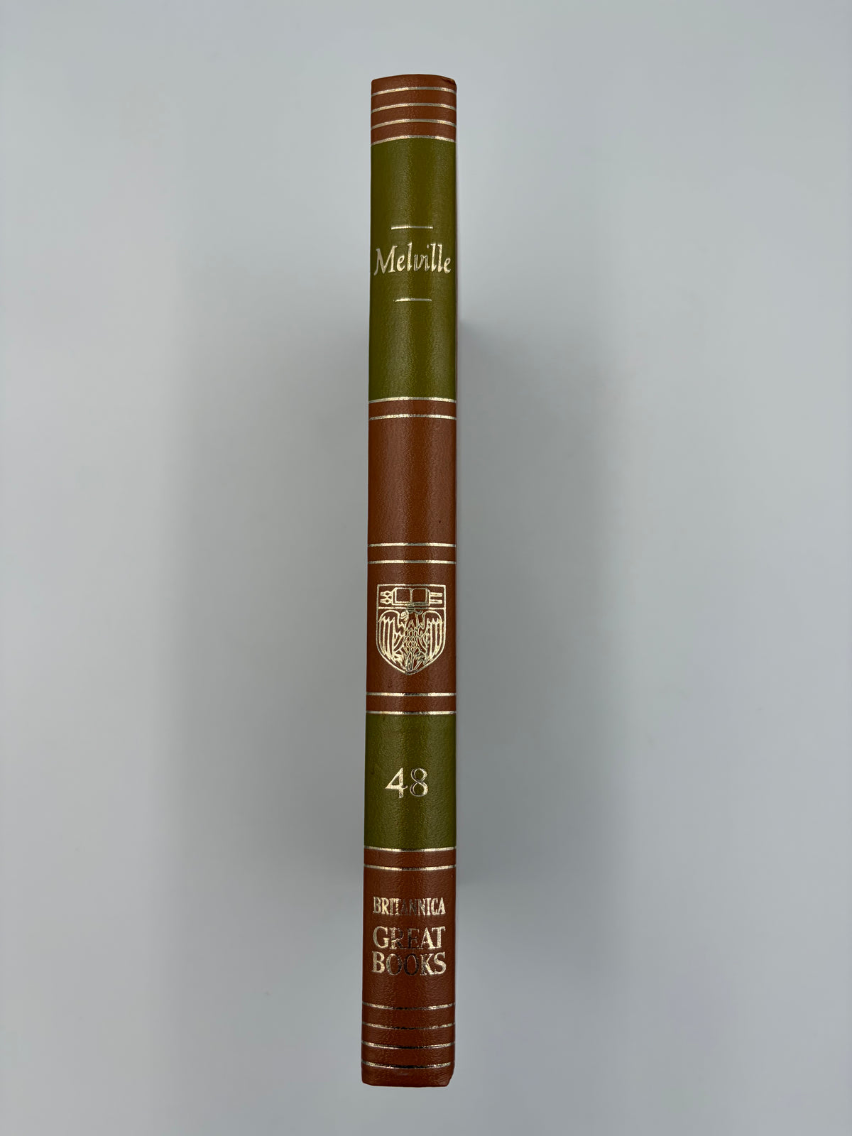 A hardcover edition of  ‘Moby-Dick; or, The Whale’ by Herman Melville standing upright.