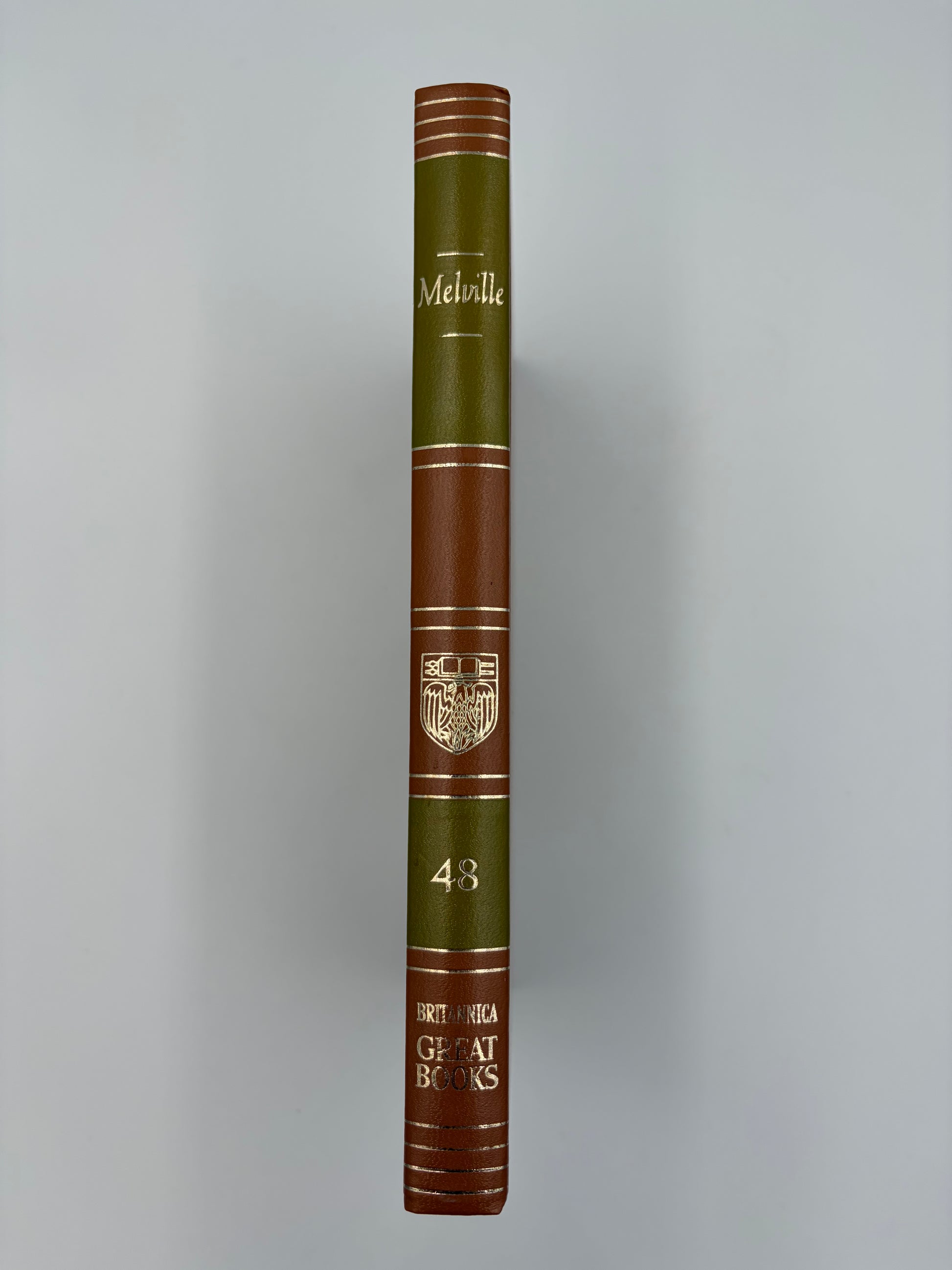 A hardcover edition of  ‘Moby-Dick; or, The Whale’ by Herman Melville standing upright.